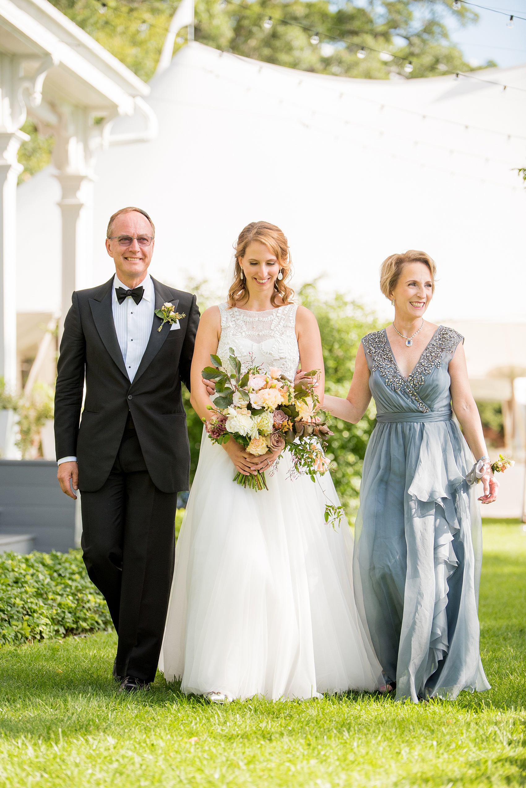 Mikkel Paige Photography photos from a Southwood Estate Wedding in Germantown, New York in the Hudson Valley. Picture of the bride and her parents walking down the aisle.