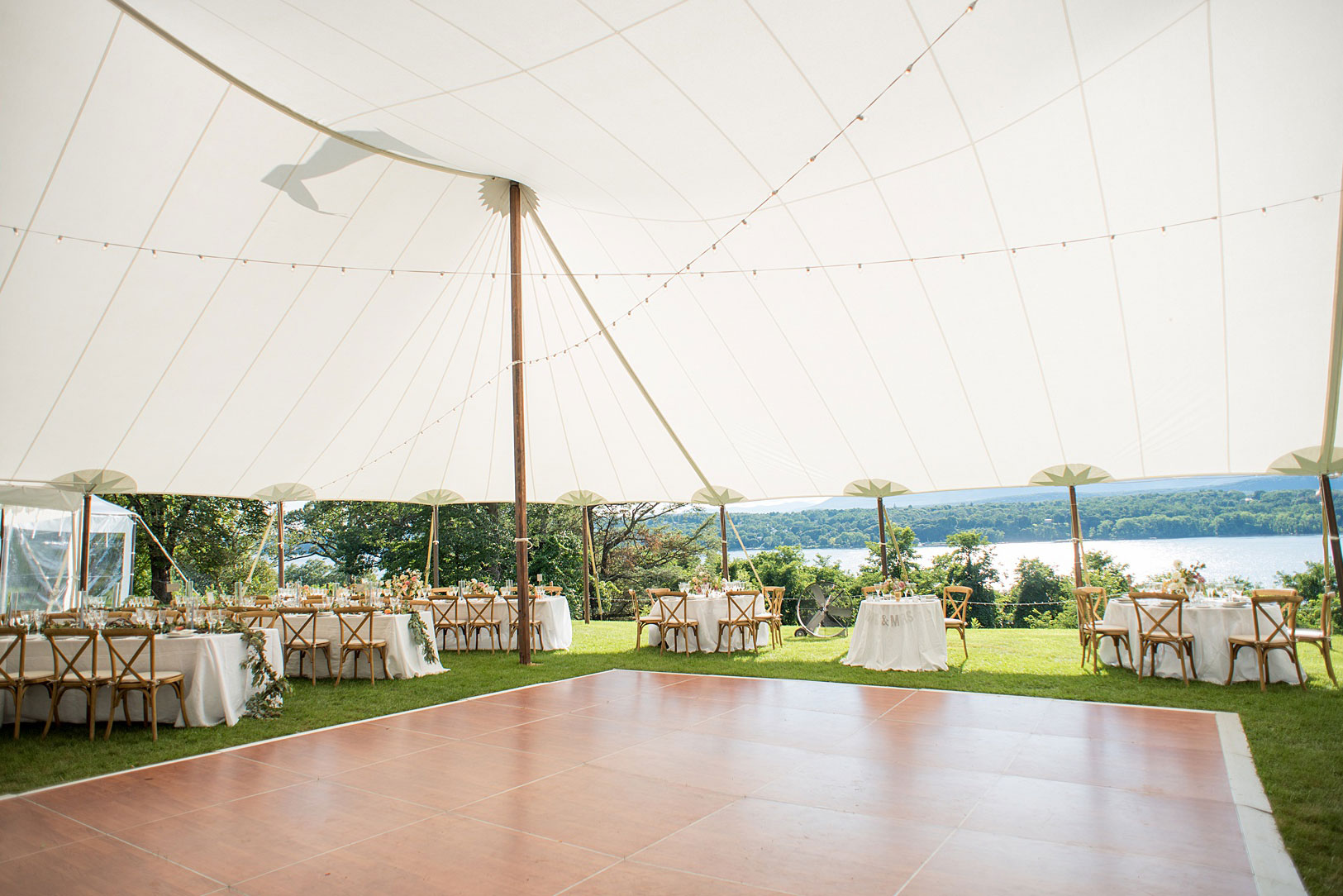 Mikkel Paige Photography photos from a Southwood Estate Wedding in Germantown, New York in the Hudson Valley. Picture of the tented reception overlooking the Hudson River.