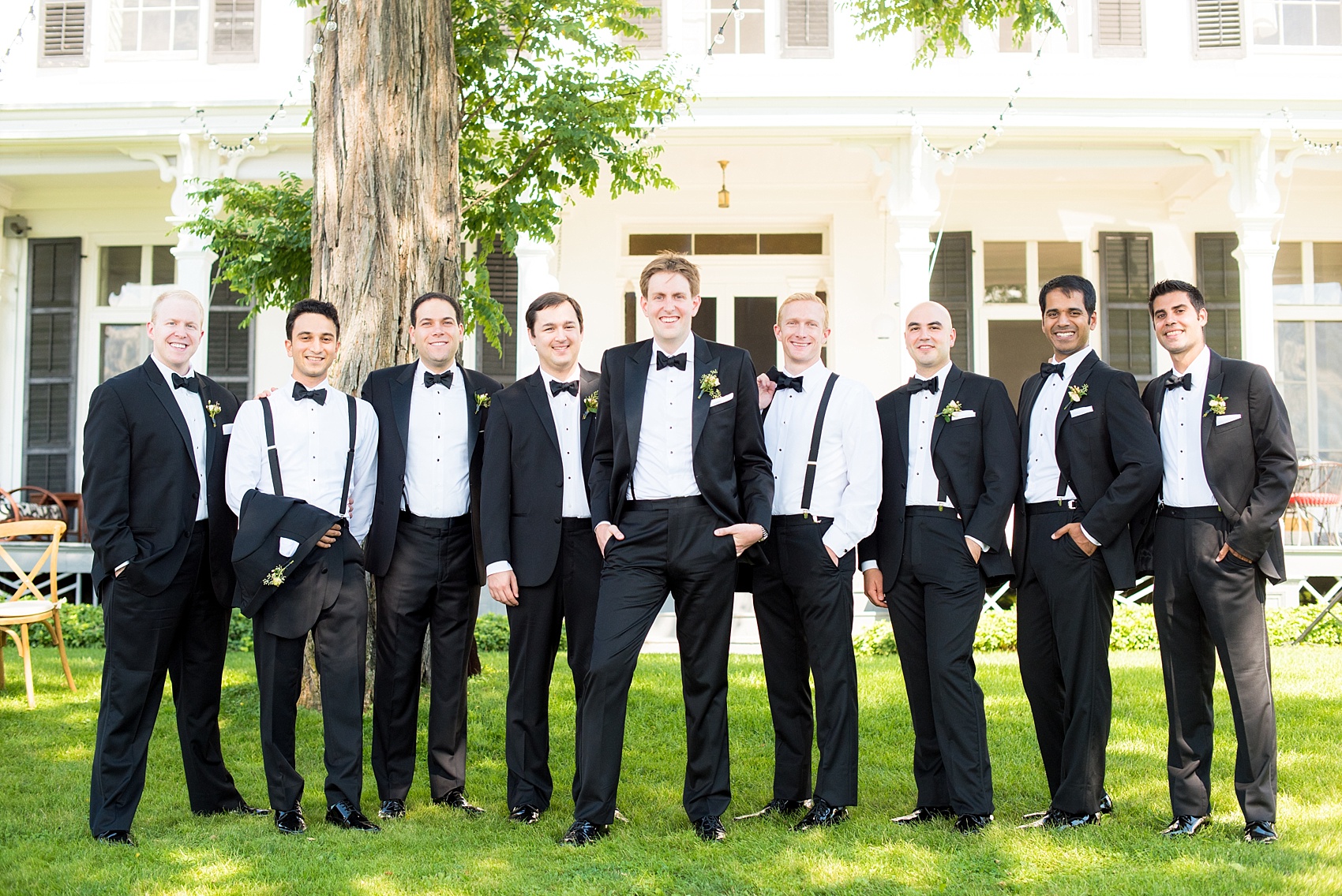 Mikkel Paige Photography photos from a wedding at Southwood Estate in Germantown, New York. Casual picture of the groom and his groomsmen in classic black tuxedos.