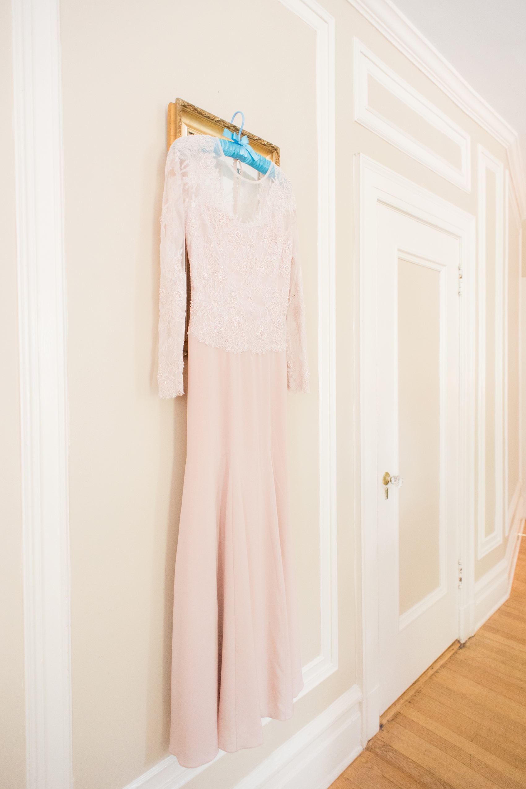 Mikkel Paige Photography photos of a wedding at Crabtree Kittle's House. Picture of the bride's custom blush, long sleeve beaded gown created by her mother.