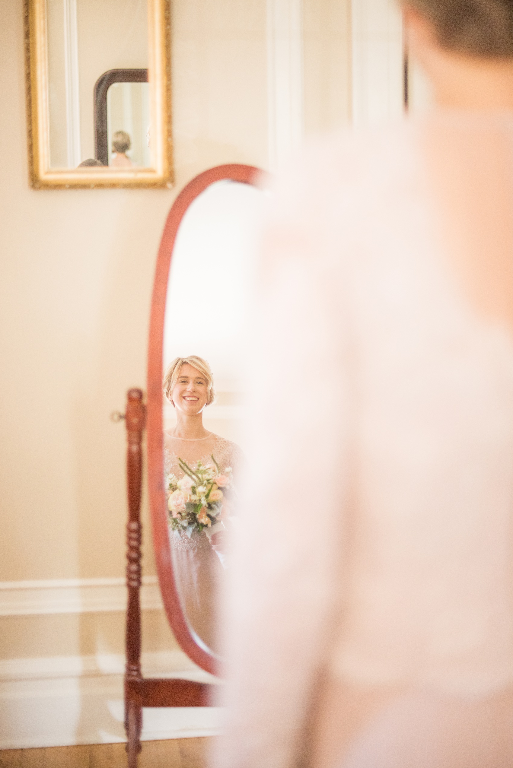Mikkel Paige Photography photos of a wedding at Crabtree Kittle's House. Picture of the bride in her custom blush, long sleeve beaded gown created by her mother.