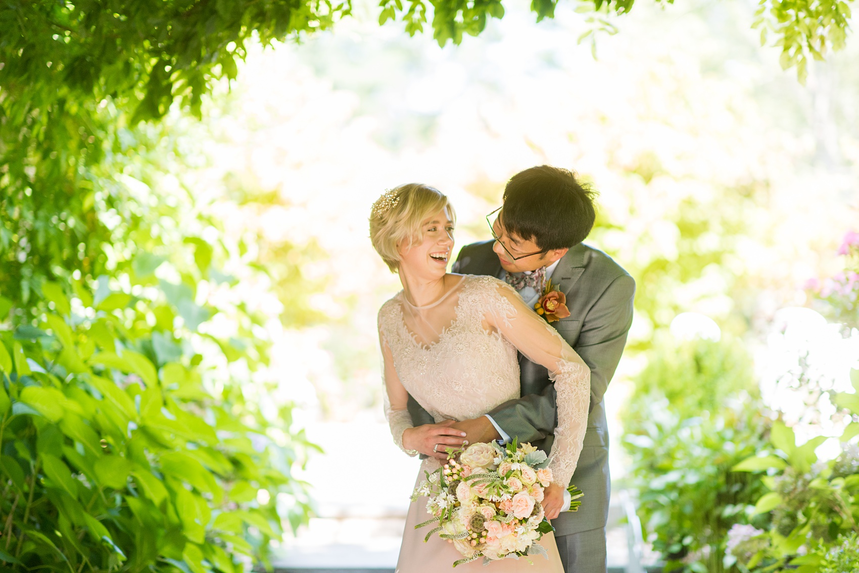 Mikkel Paige Photography photos of a wedding at Crabtree Kittle's House. Picture of the bride and groom smiling and embracing in the garden.