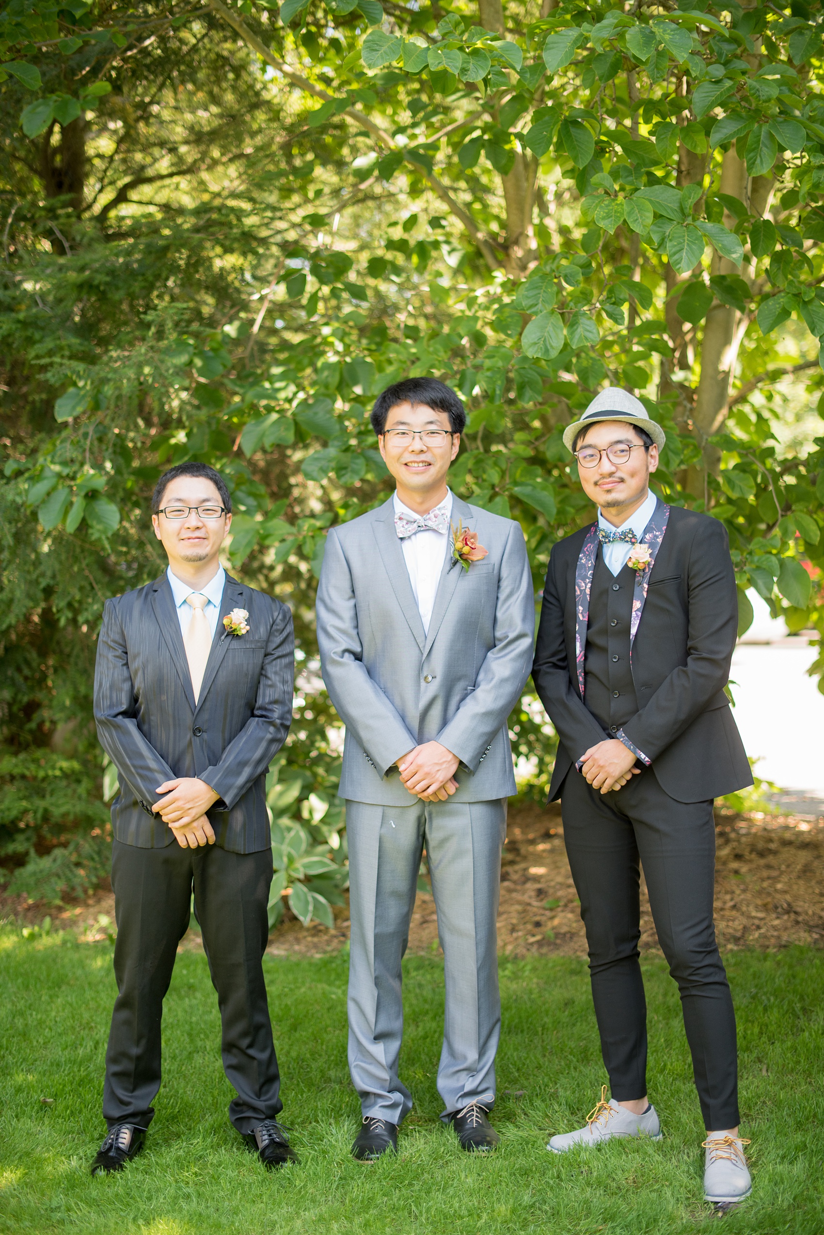 Mikkel Paige Photography photos of a wedding at Crabtree Kittle's House. Picture of the groom and his two groomsmen.