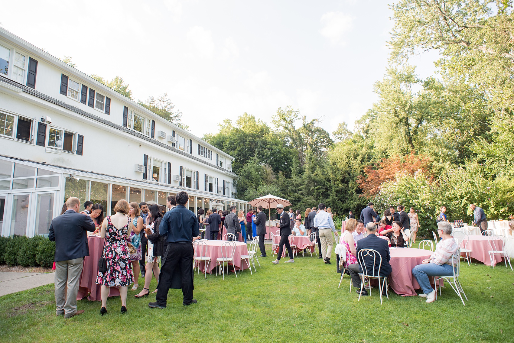 Mikkel Paige Photography photos of a wedding at Crabtree Kittle's House. Picture of the summer outdoor cocktail hour.