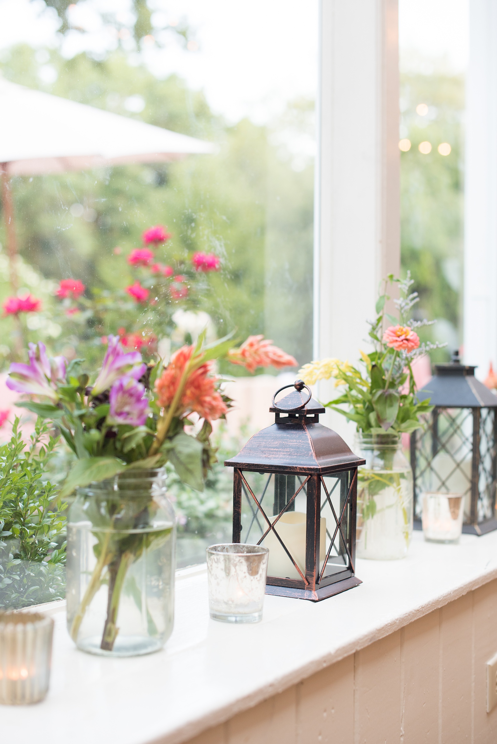 Mikkel Paige Photography photos of a wedding at Crabtree Kittle's House. Picture of the reception decorations including lanterns and wildflowers.