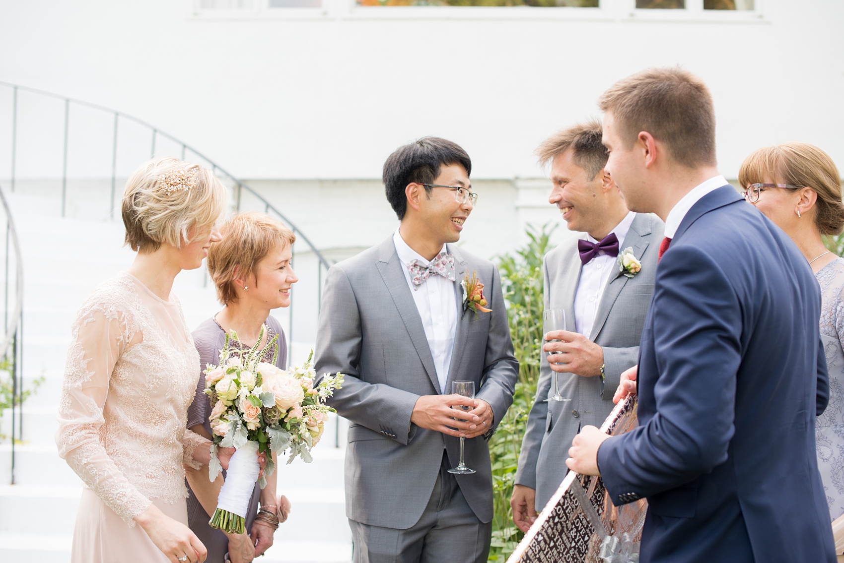 Mikkel Paige Photography photos of a wedding at Crabtree Kittle's House. Picture of the bride and groom during cocktail hour with their families. 