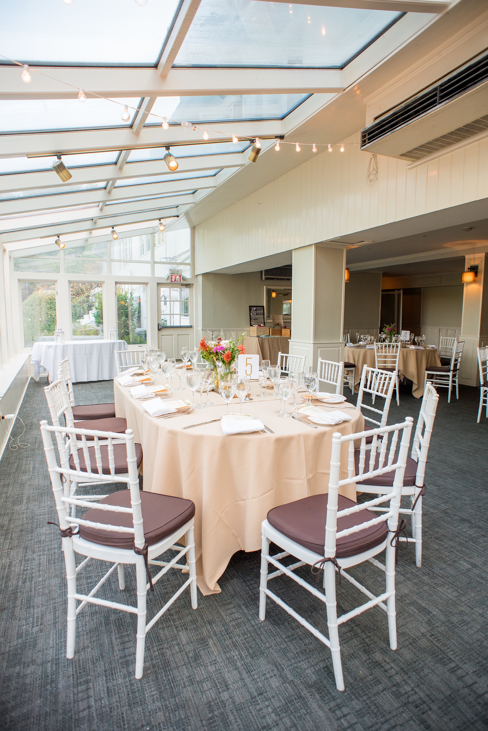 Mikkel Paige Photography photos of a wedding at Crabtree Kittle's House. Picture of the indoor summer reception area.