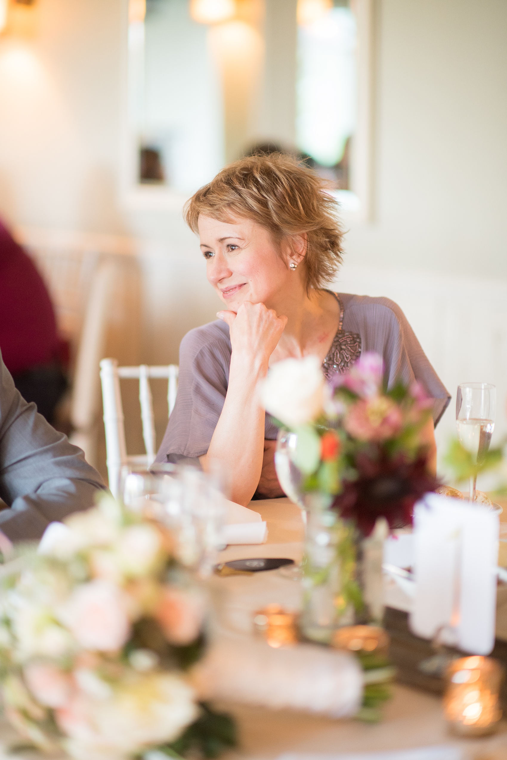 Mikkel Paige Photography photos of a wedding at Crabtree Kittle's House. Candid picture of the mother of the bride during the reception. 