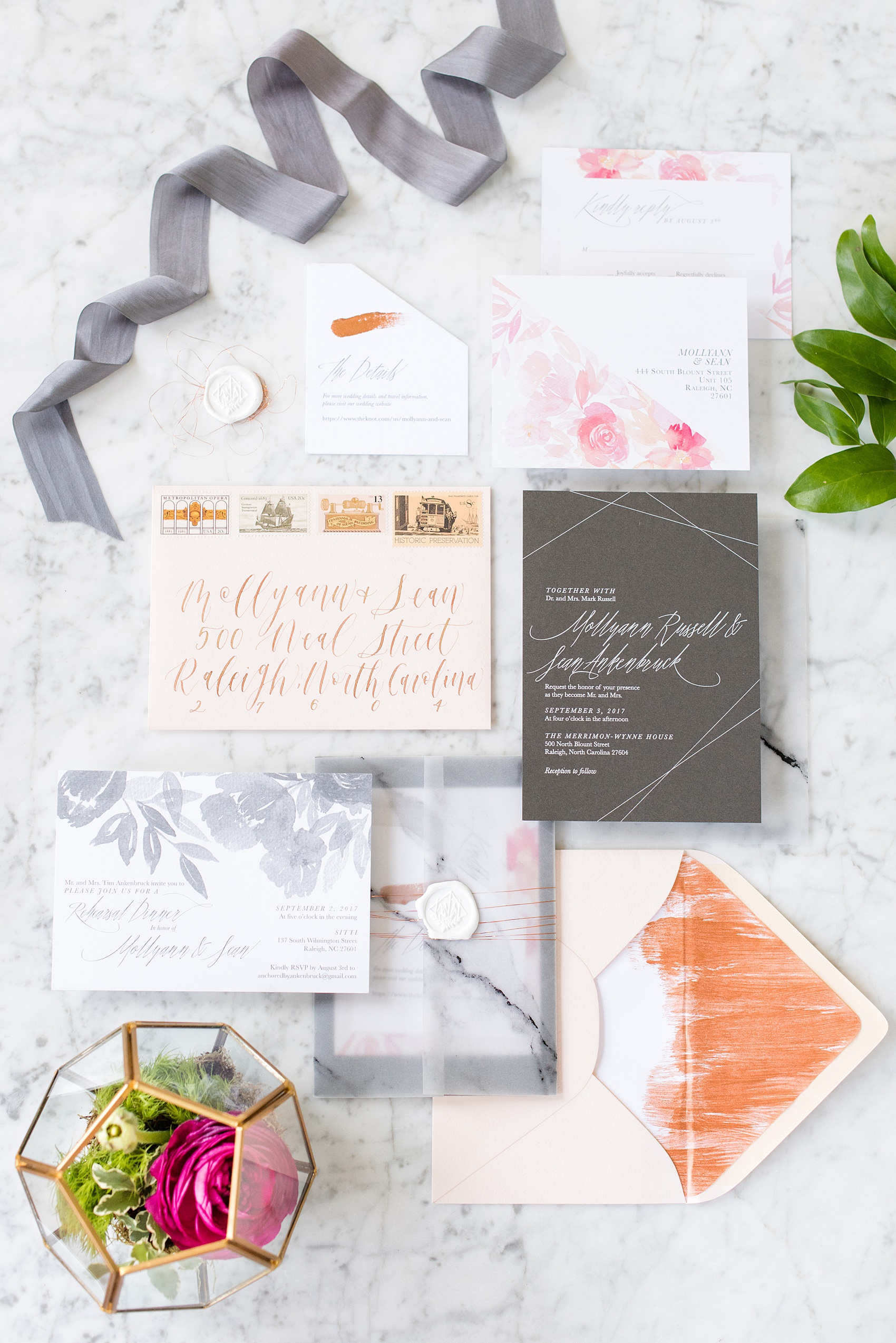 Mikkel Paige Photography pictures from a wedding at Merrimon-Wynne House in Raleigh, NC. Detail photo of the invitation suite with modern geometrics and watercolor flowers, and marble. Invitation suite by One and Only Paper, calligraphy by Quietude Co.