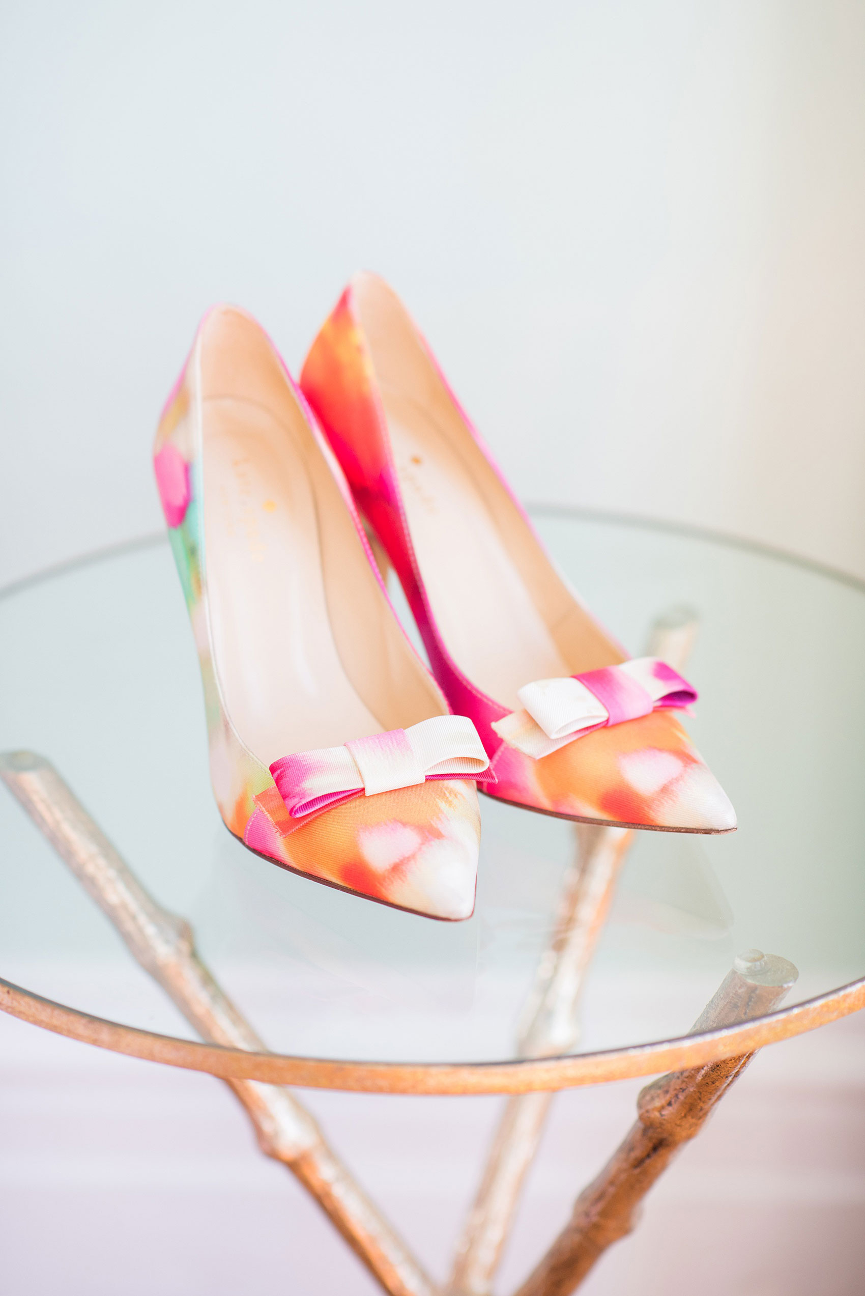 Mikkel Paige Photography pictures from a wedding at Merrimon-Wynne House in Raleigh, NC. Photo of the bride's colorful Ikat Kate Spade shoes.