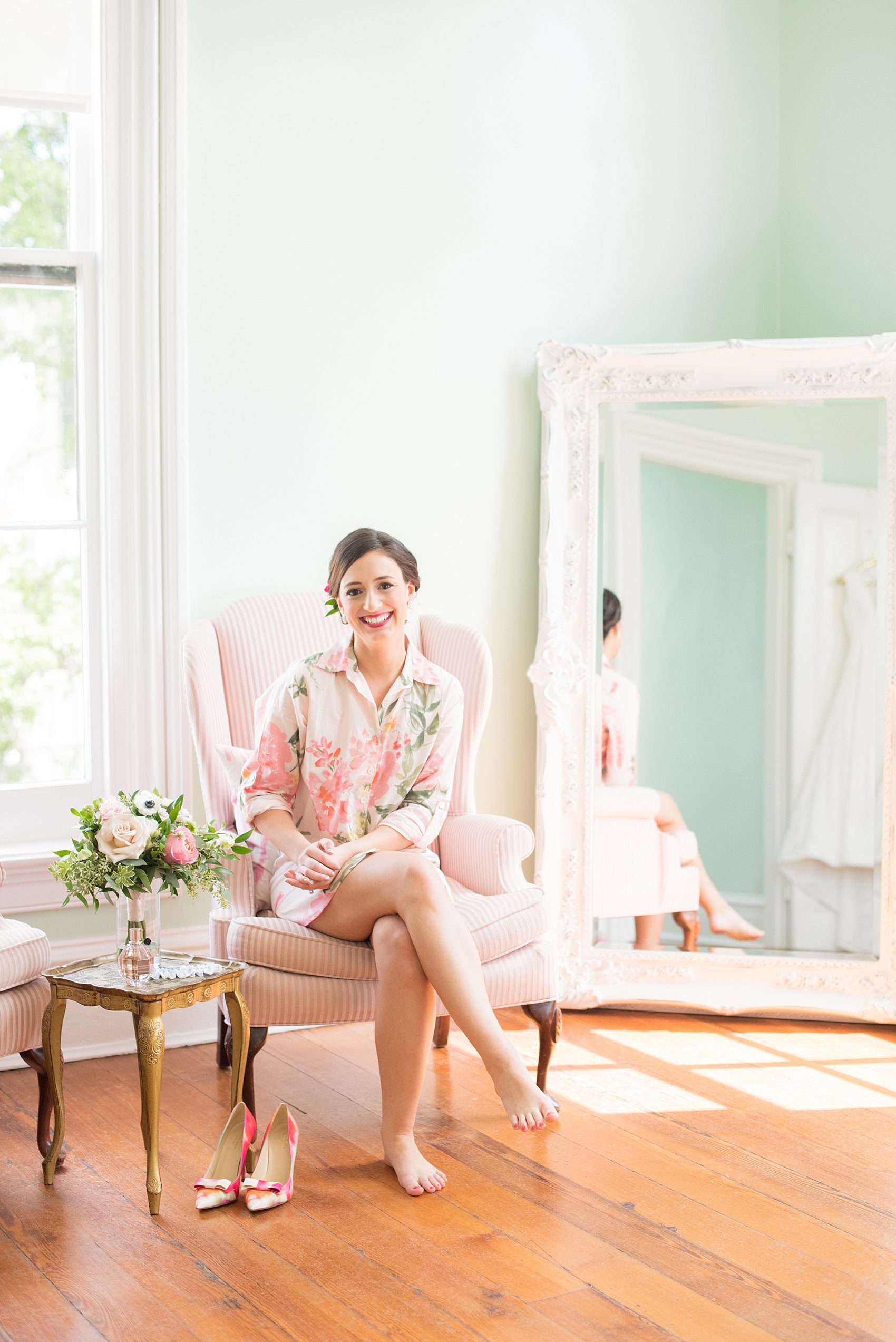 Mikkel Paige Photography pictures from a wedding at Merrimon-Wynne House in Raleigh, NC. Photo of the bride getting ready in the bridal suite.