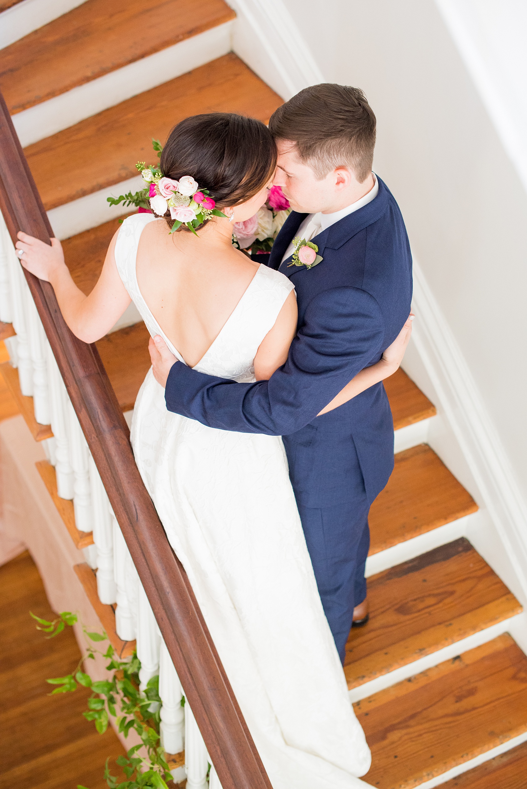 Mikkel Paige Photography pictures from a wedding at Merrimon-Wynne House in Raleigh, NC. Photo of the bride and groom on the stairs of the historic southern home.