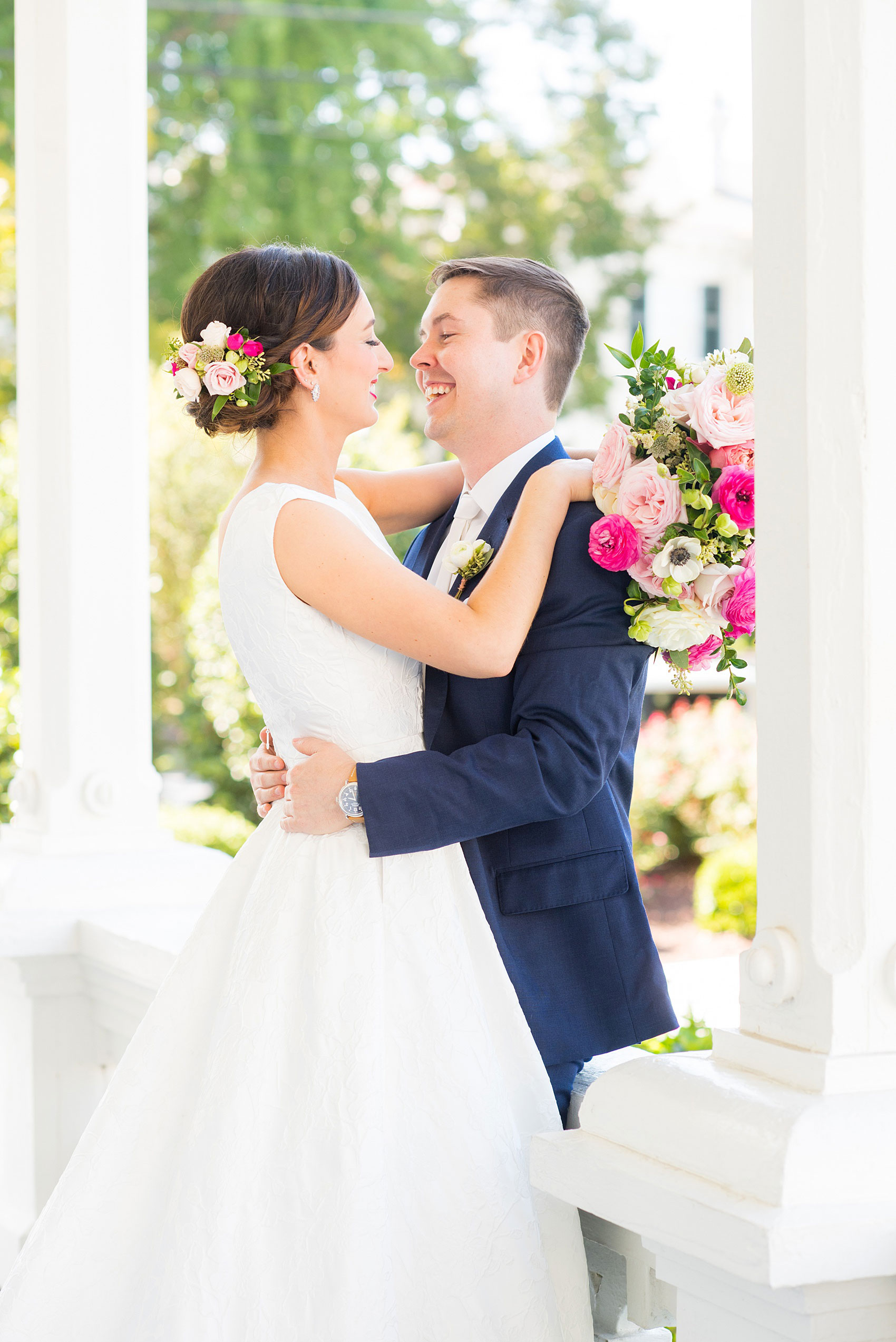 Mikkel Paige Photography pictures from a wedding at Merrimon-Wynne House in Raleigh, NC. Photo of the bride and groom on the porch of the historic home.