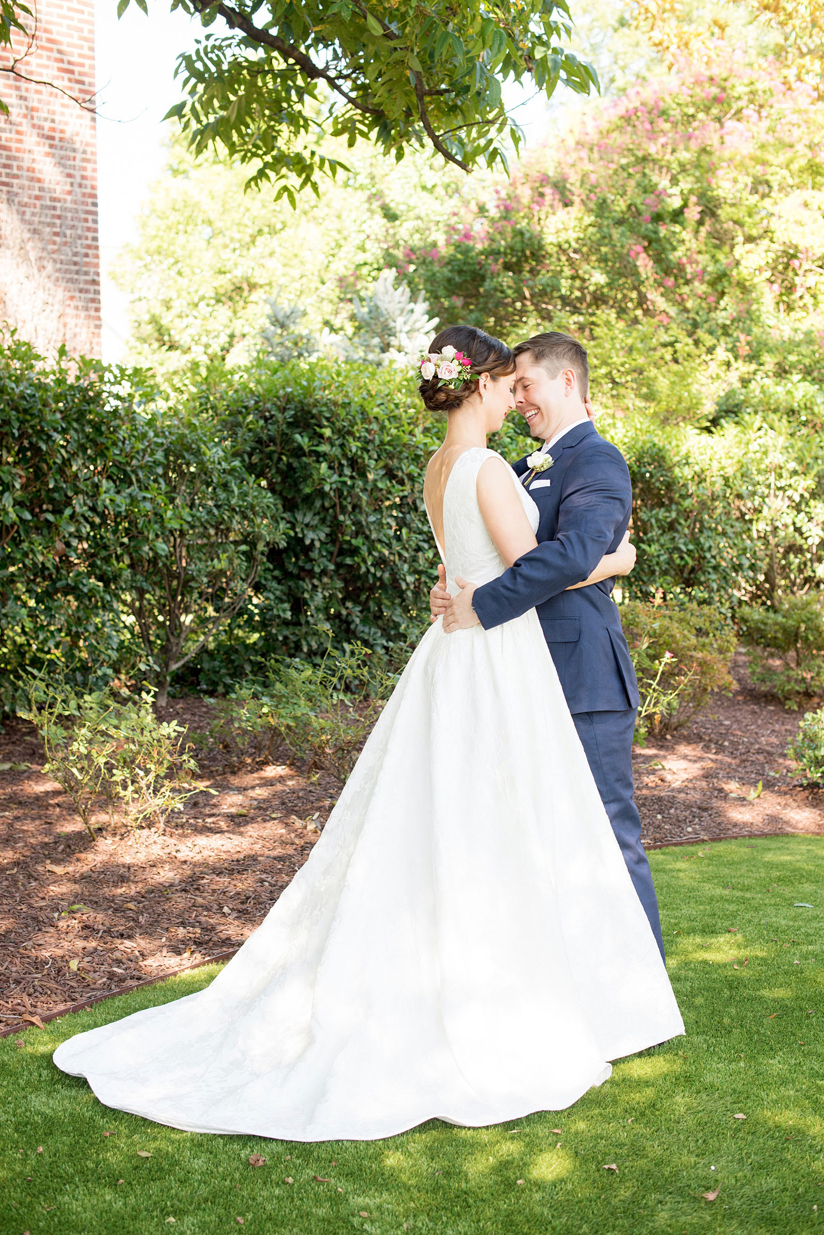 Mikkel Paige Photography pictures from a wedding at Merrimon-Wynne House in Raleigh, NC. Photo of the bride and groom on the lawn of the historic home.