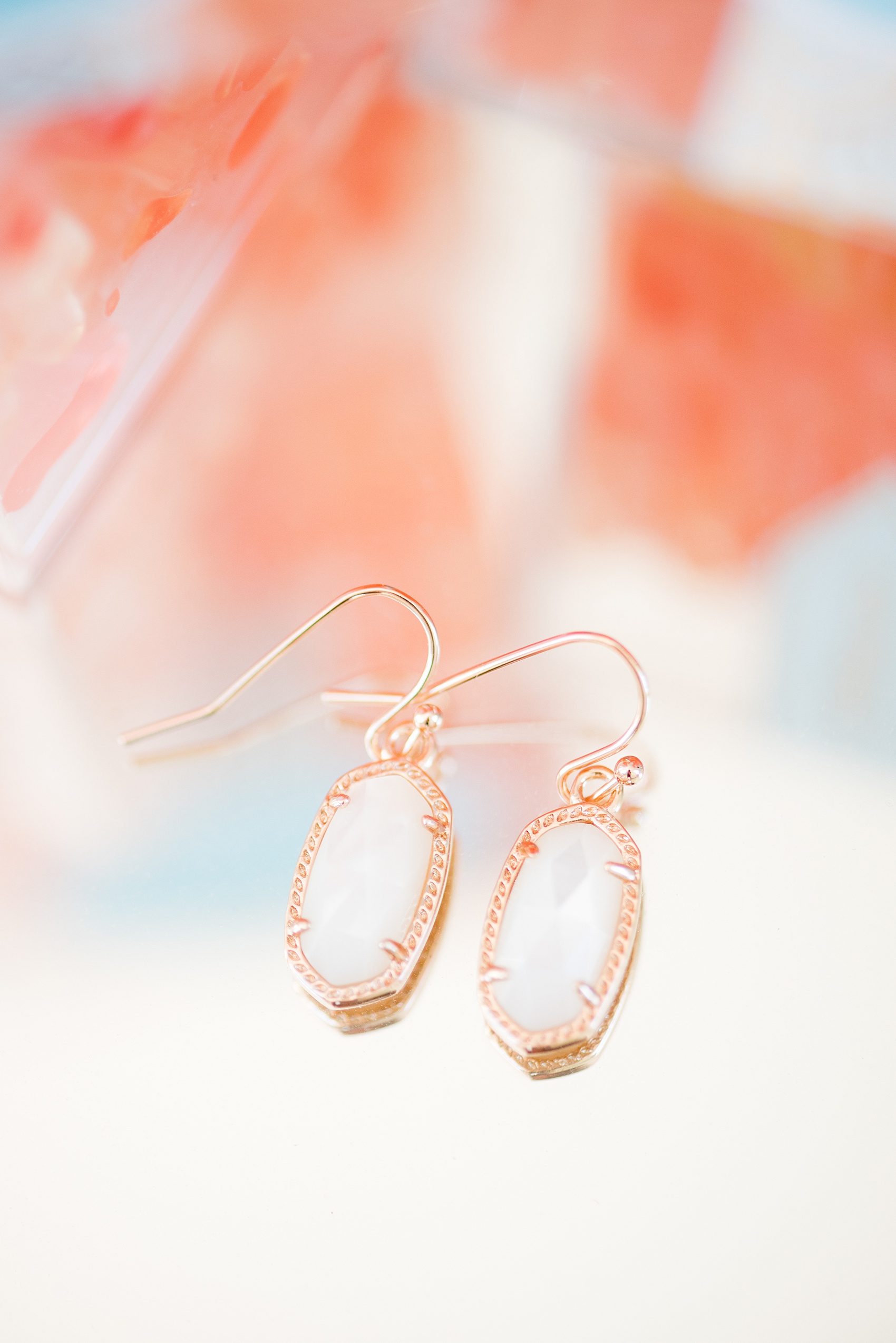 Mikkel Paige Photography pictures from a wedding at Merrimon-Wynne House in Raleigh, NC. Detail photo of the Kendra Scott earrings the bride gifted her bridesmaids.