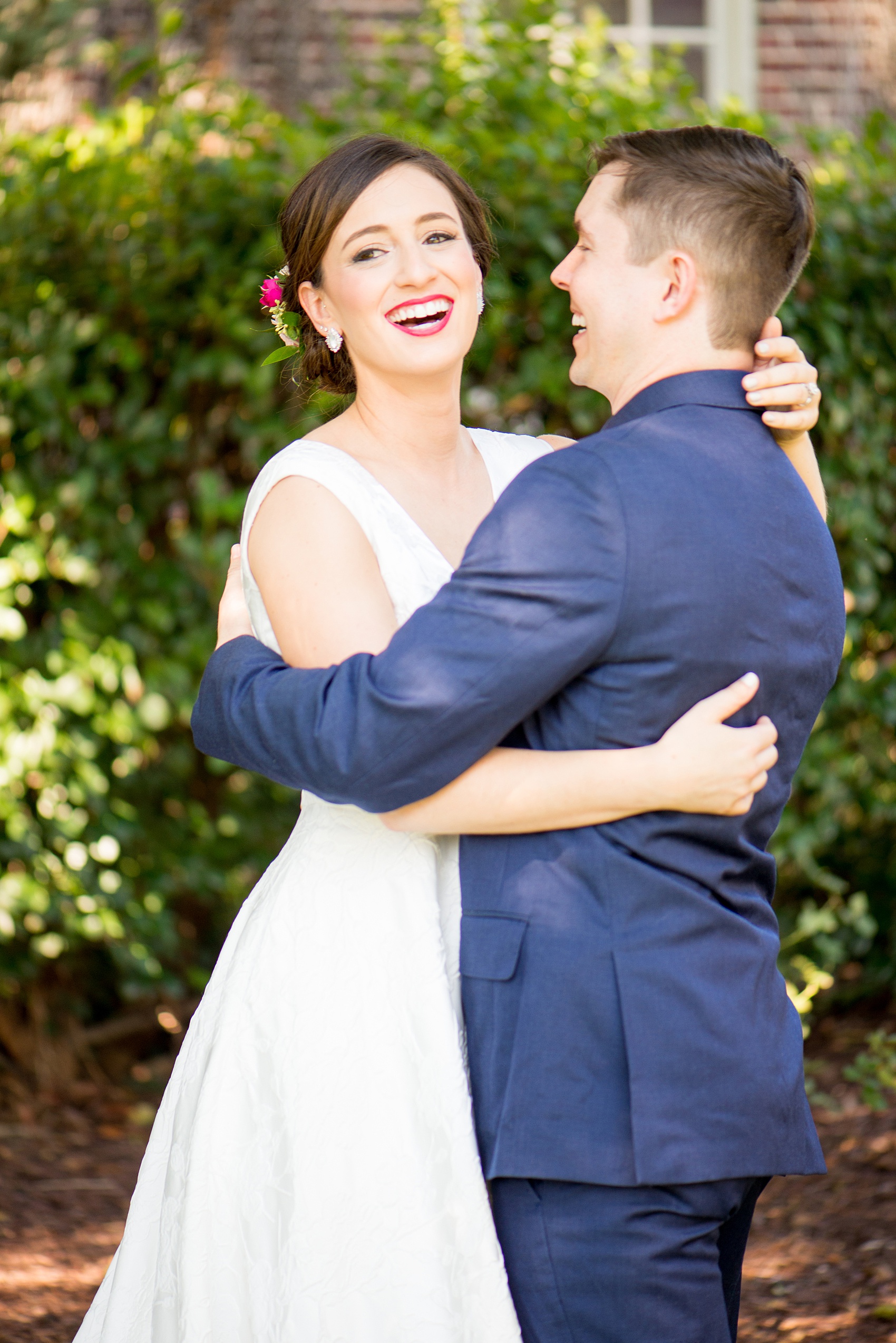 Mikkel Paige Photography pictures from a wedding at Merrimon-Wynne House in Raleigh, NC. Candid photo of the bride and groom.