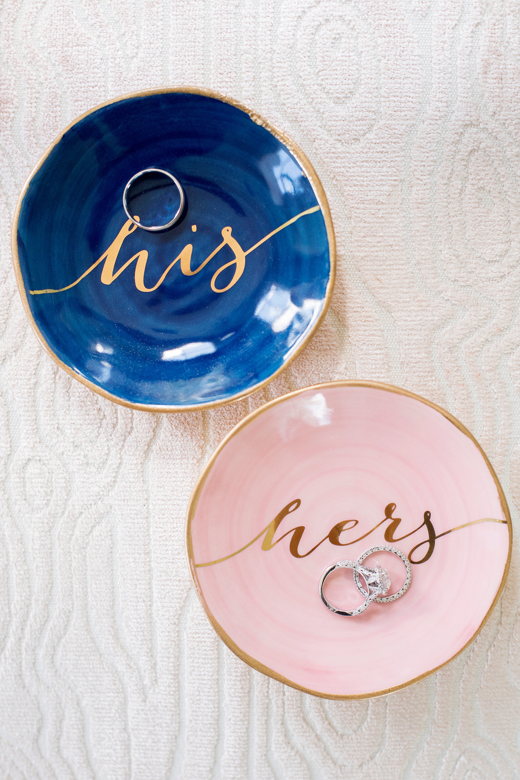 Mikkel Paige Photography pictures from a wedding at Merrimon-Wynne House in Raleigh, NC. Detail photo of the rings in his and hers colorful script ring dishes.