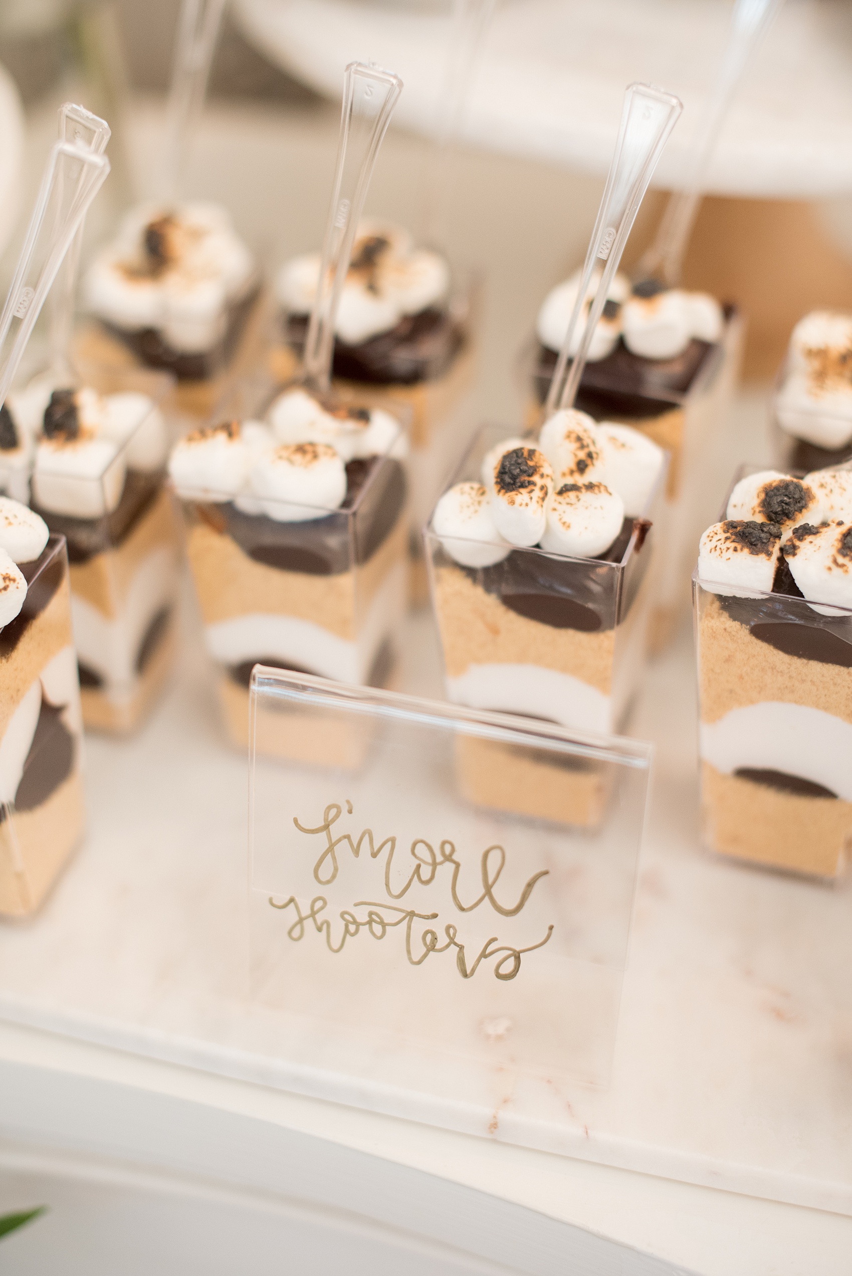 Mikkel Paige Photography pictures from a wedding at Merrimon-Wynne House in Raleigh, NC. Photo of s'mores cups on the dessert table.