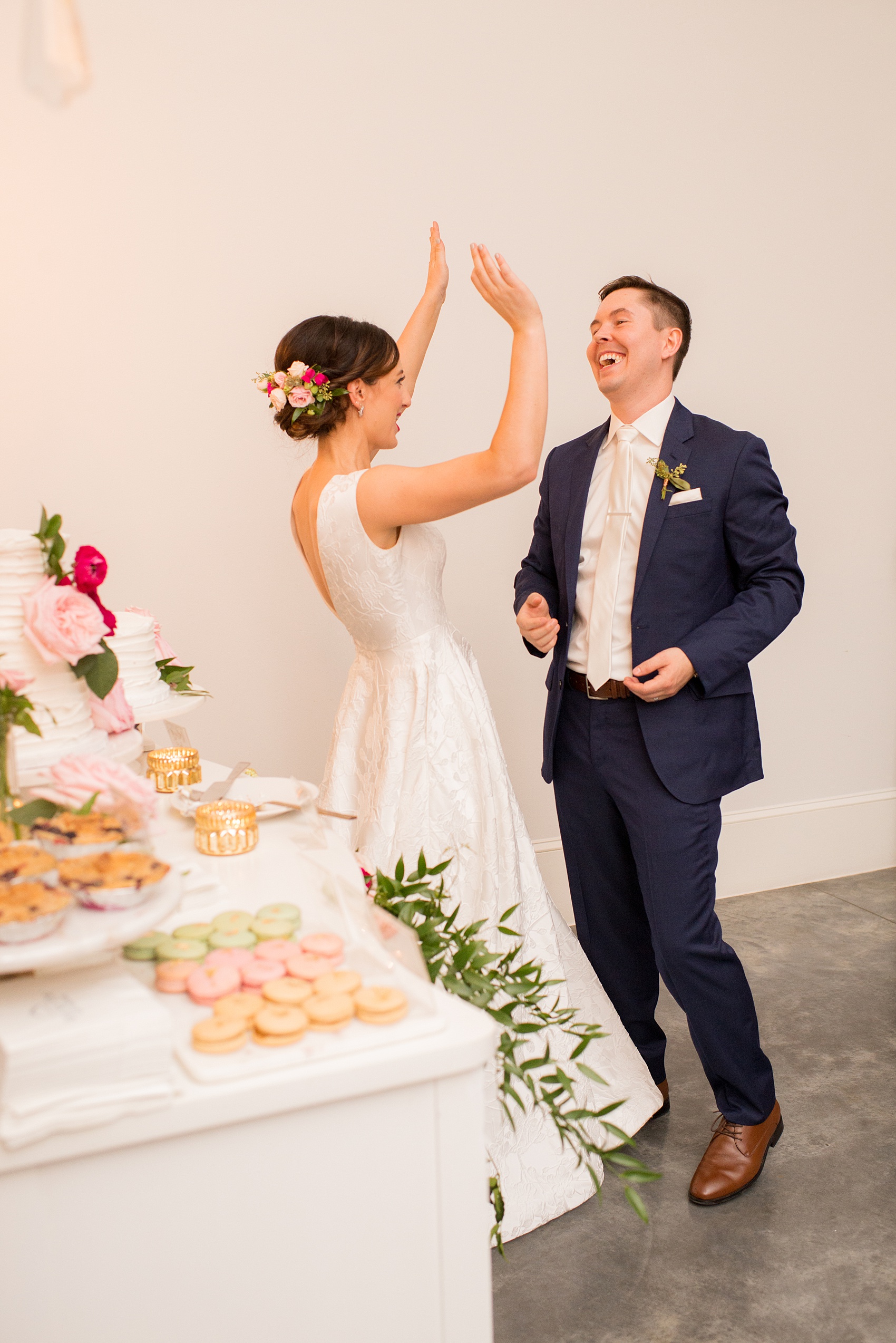 Mikkel Paige Photography pictures from a wedding at Merrimon-Wynne House in Raleigh, NC. Photo of a bride and groom after their cake cutting.