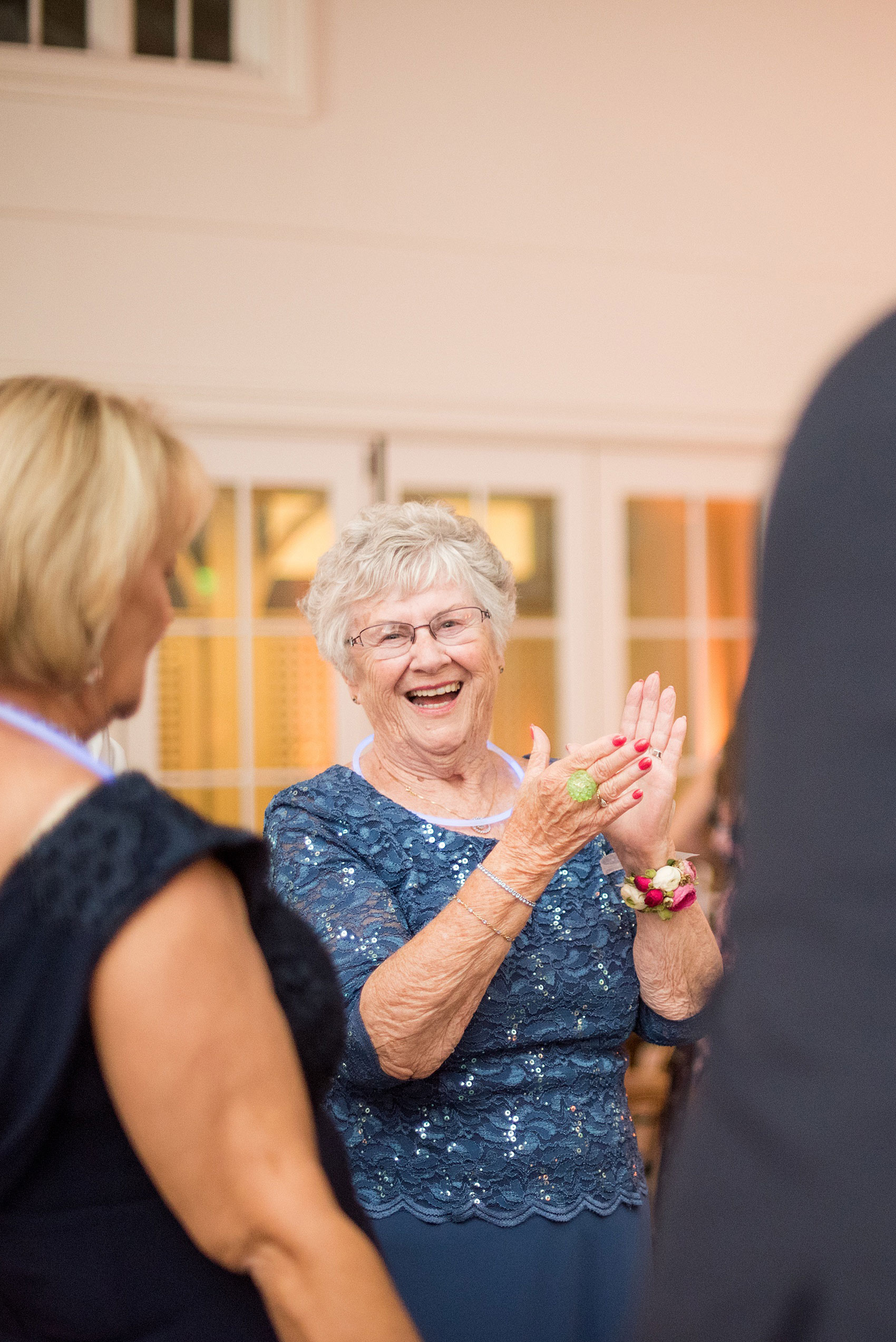 Mikkel Paige Photography pictures from a wedding at Merrimon-Wynne House in Raleigh, NC. Photo of a guest dancing in the Carriage House during the reception.