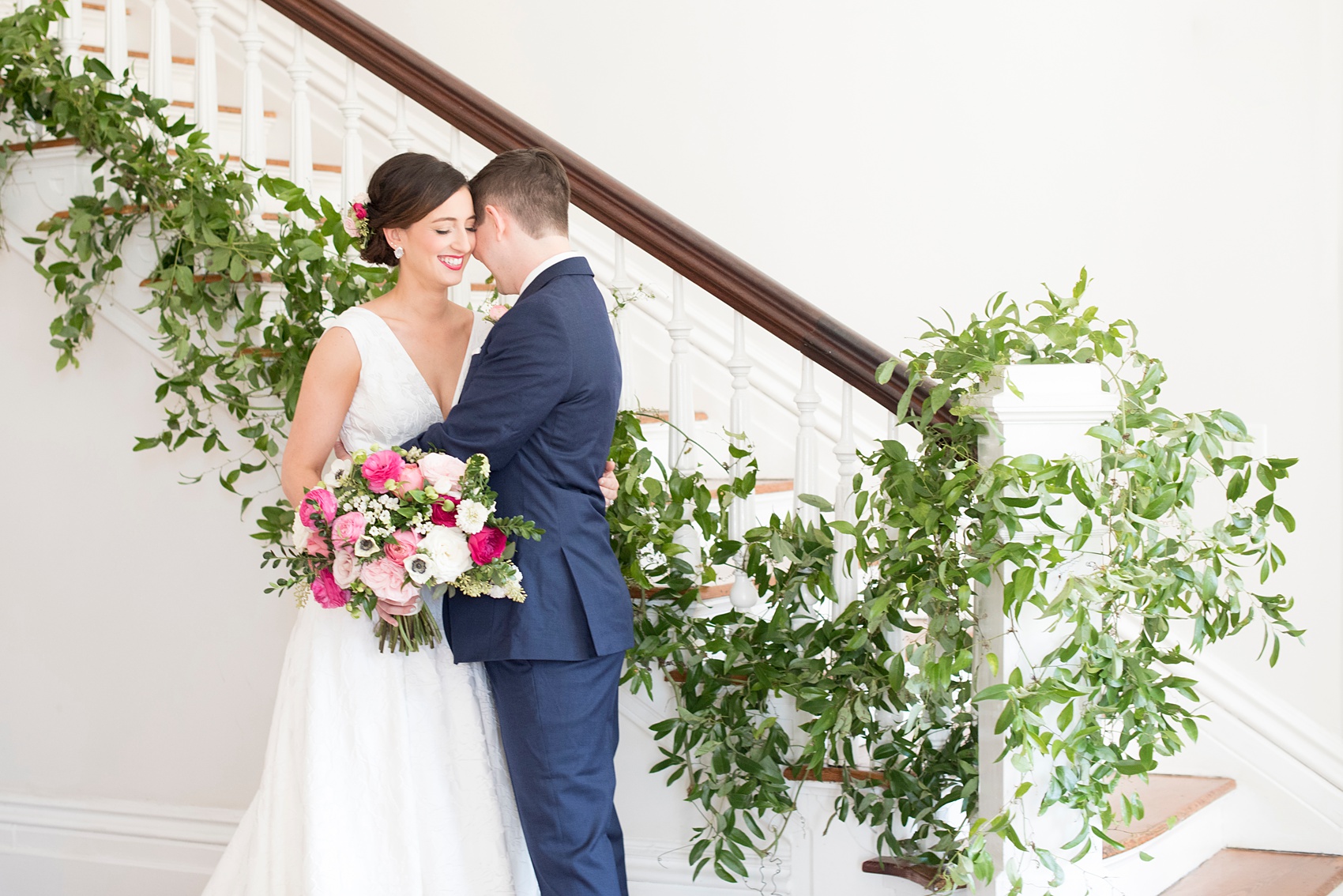 Mikkel Paige Photography pictures from a Merrimon-Wynne House wedding in Raleigh, NC. Photo of the bride and groom near the staircase after their first look.