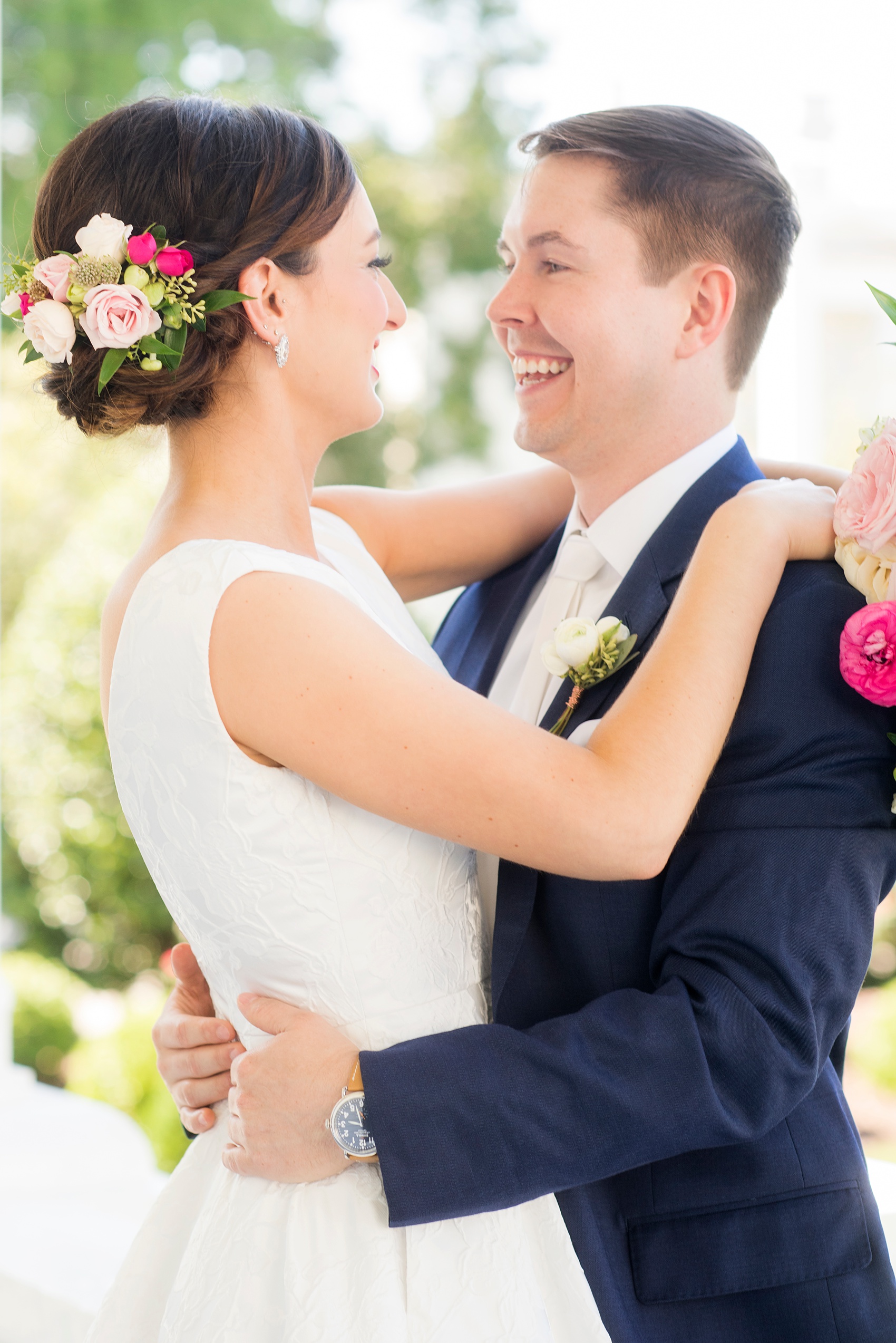 Mikkel Paige Photography pictures from a Merrimon-Wynne House wedding in Raleigh, NC. Photo of the bride and groom with bridal flowers in her hair.