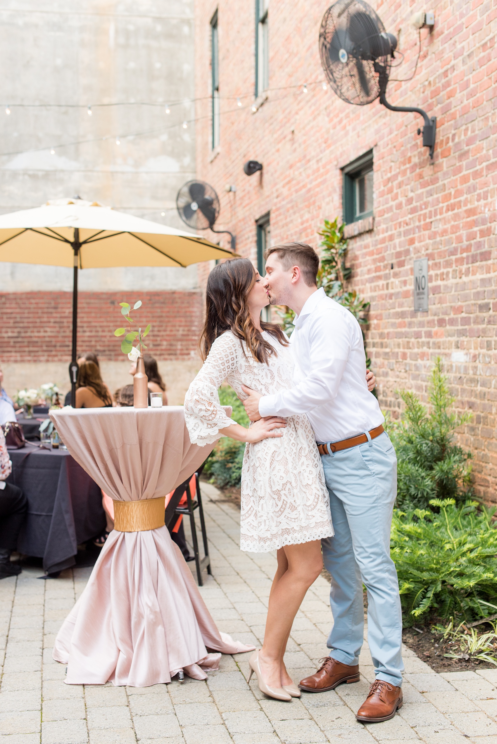 Mikkel Paige Photography photos from a downtown Raleigh wedding rehearsal dinner at Sitti restaurant. Picture of the bride and groom.