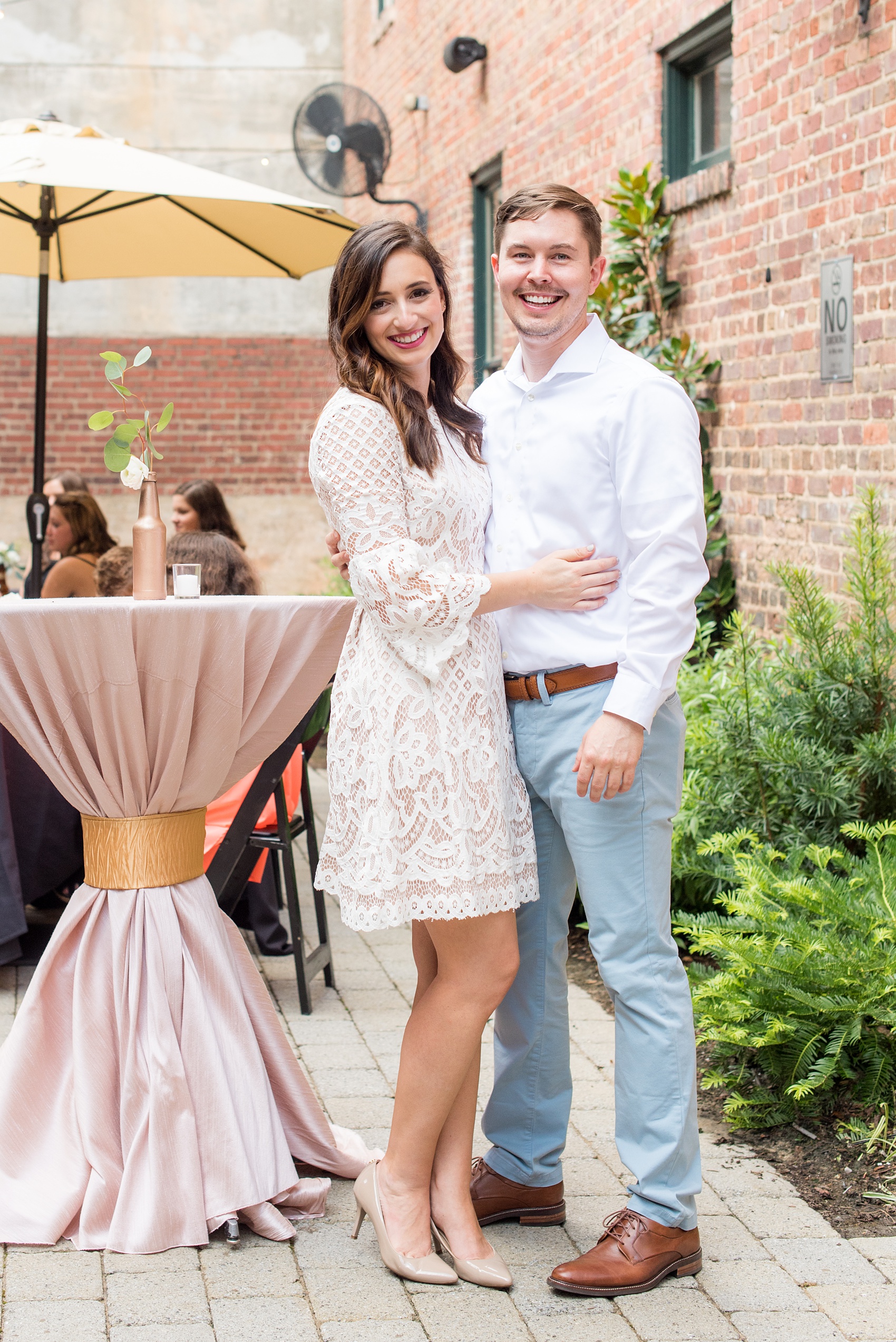 Mikkel Paige Photography photos from a downtown Raleigh wedding rehearsal dinner at Sitti restaurant. Picture of the bride and groom.