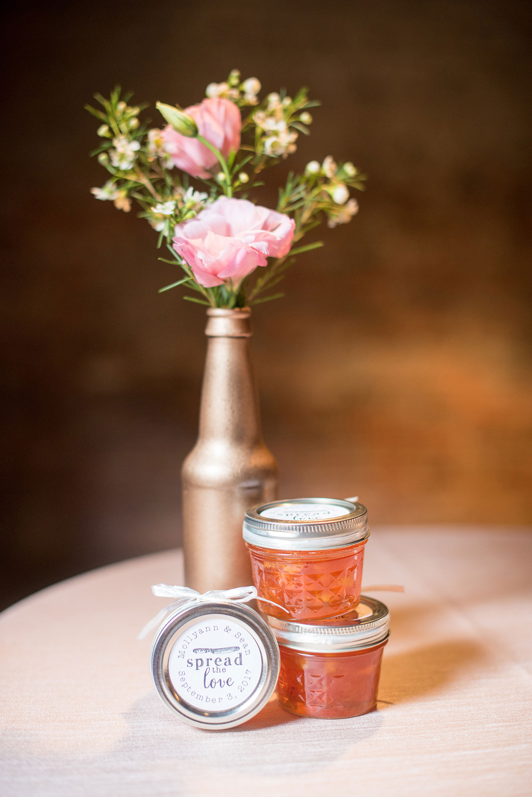 Mikkel Paige Photography photos from a downtown Raleigh wedding rehearsal dinner at Sitti restaurant. Photo of the custom jam jars they gave out as guest favors.