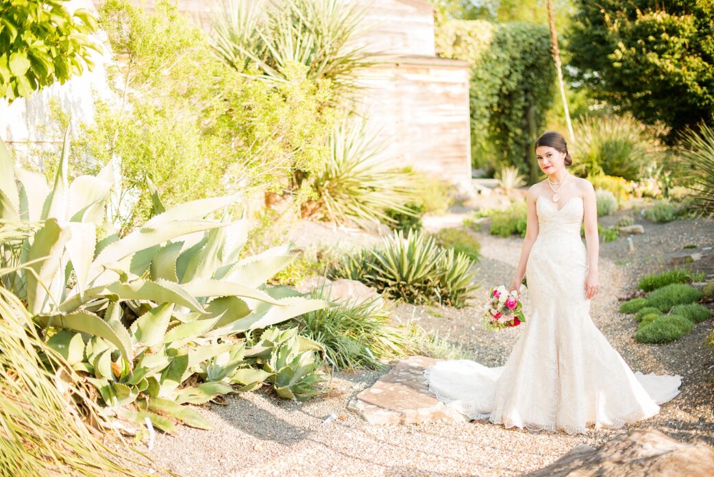 Mikkel Paige Photography photos from a bridal session at Raleigh's JC Raulston Arboretum on North Carolina's NC State campus. The bride wore an off-white vintage lace gown with a cameo and pearl necklace.