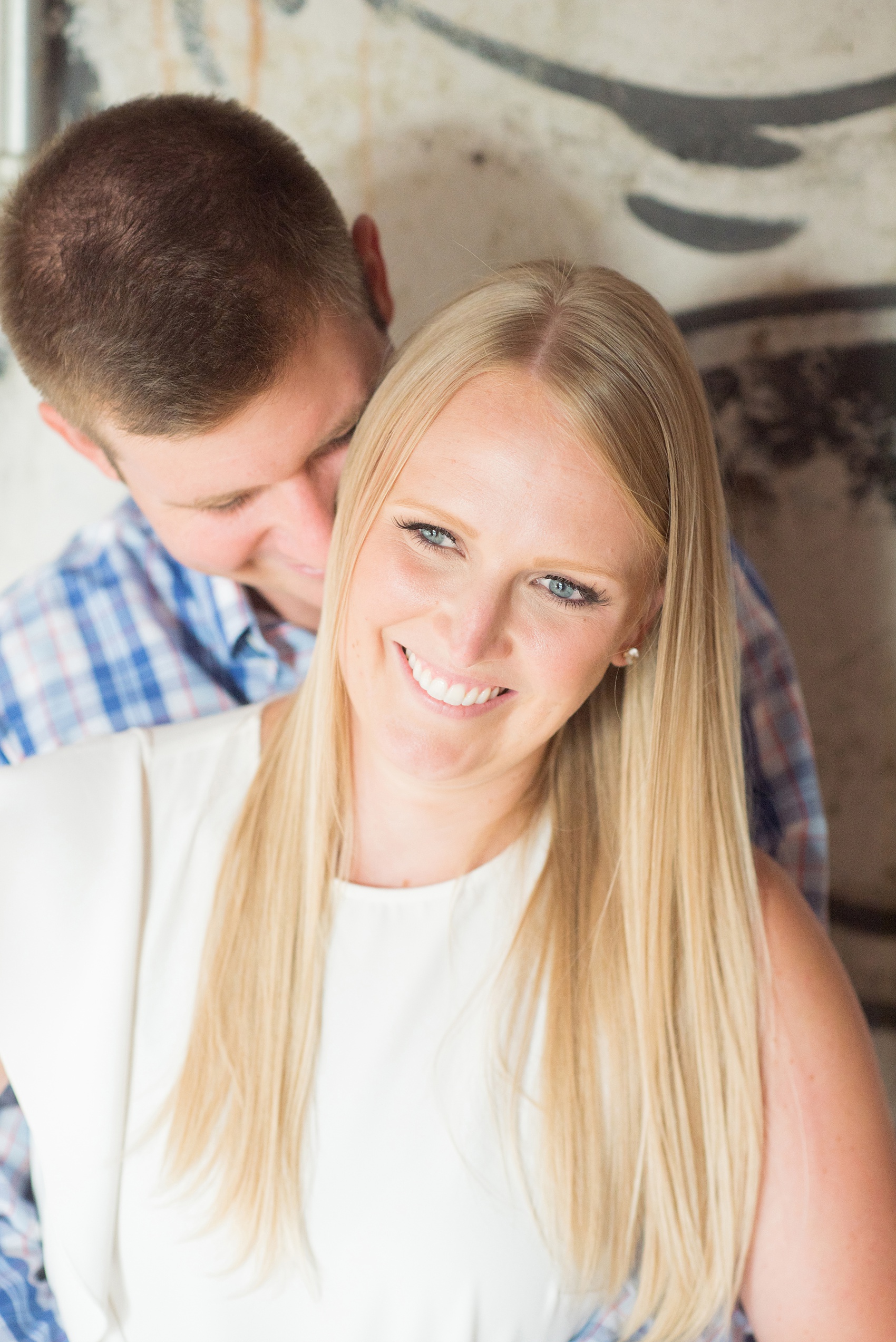 Mikkel Paige Photography photos from an engagement session at Durham's American Tobacco Campus in North Carolina. Sweet close-up photo of the couple.