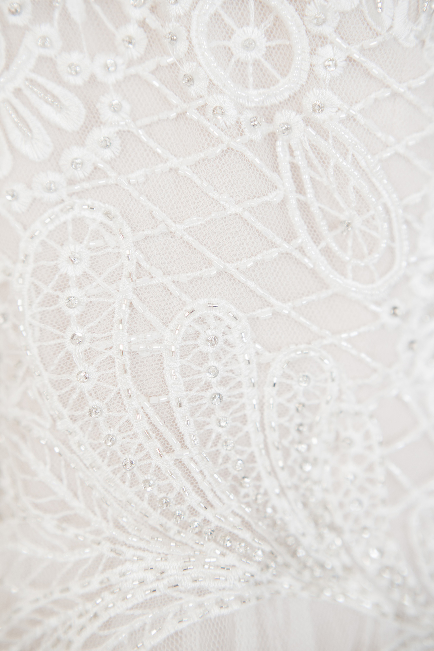 Mikkel Paige Photography photos from a wedding at Grand Paraiso, Mexico, Playa del Carmen Iberostar resort. Detail picture of the bride's lace detail on her gown.