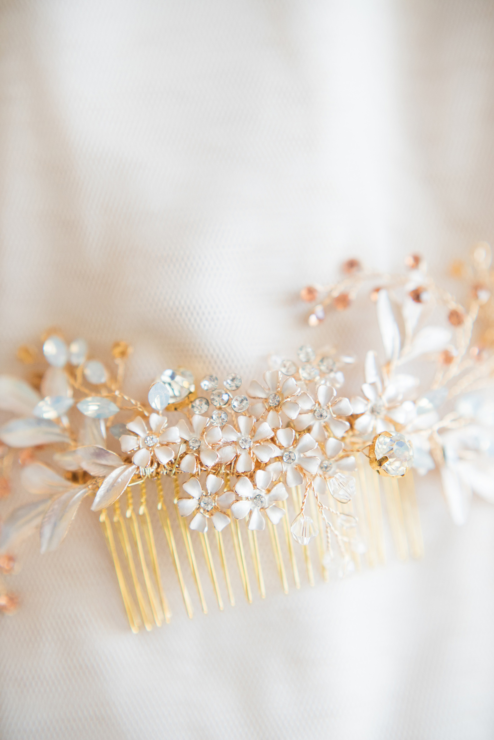 Mikkel Paige Photography photos from a wedding at Grand Paraiso, Mexico, Playa del Carmen Iberostar resort. Detail picture of the bride's rhinestone hair comb.