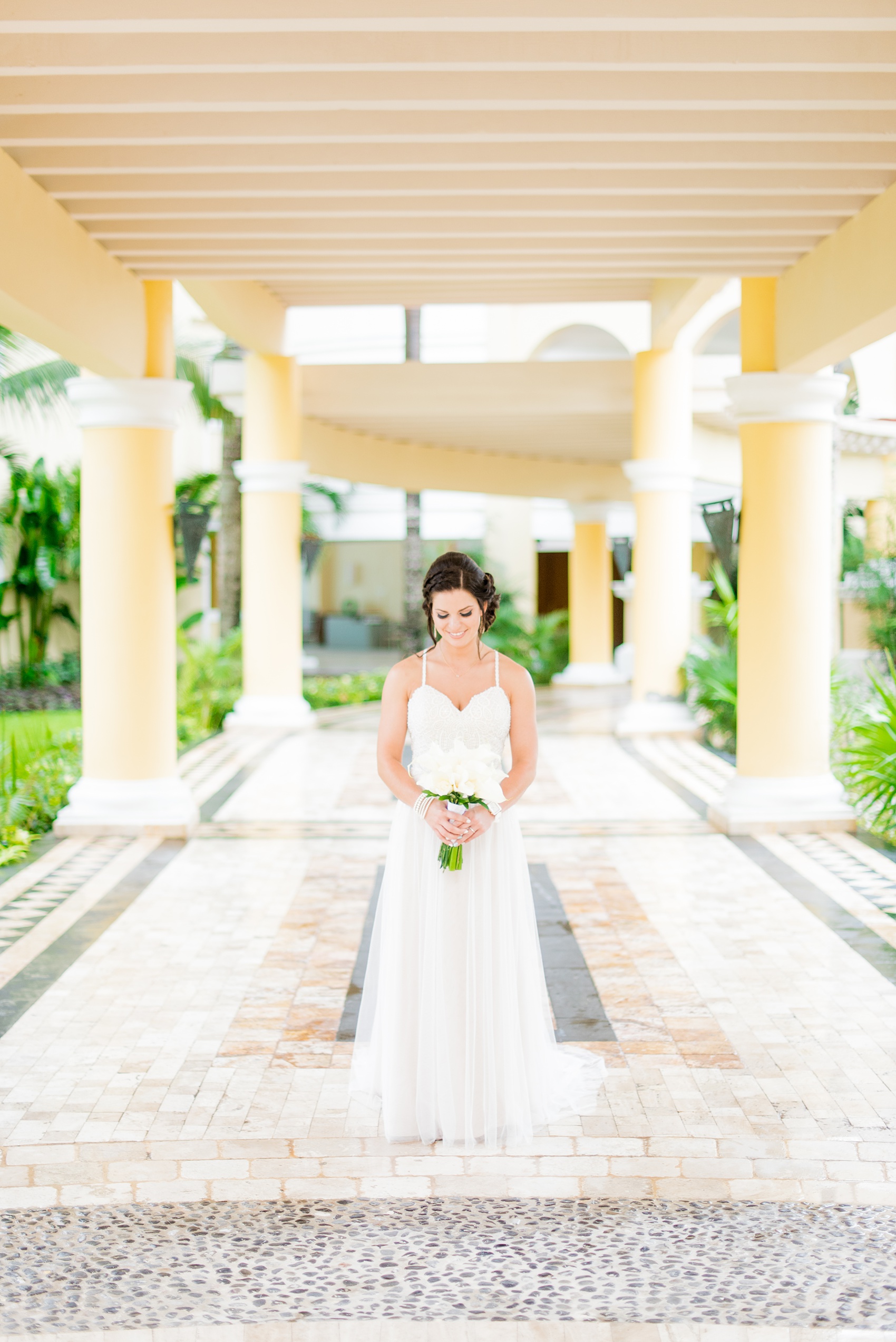 Mikkel Paige Photography photos from a wedding at Grand Paraiso, Mexico, Playa del Carmen Iberostar resort. Picture of the bride in her beach dress with tulle skirt.