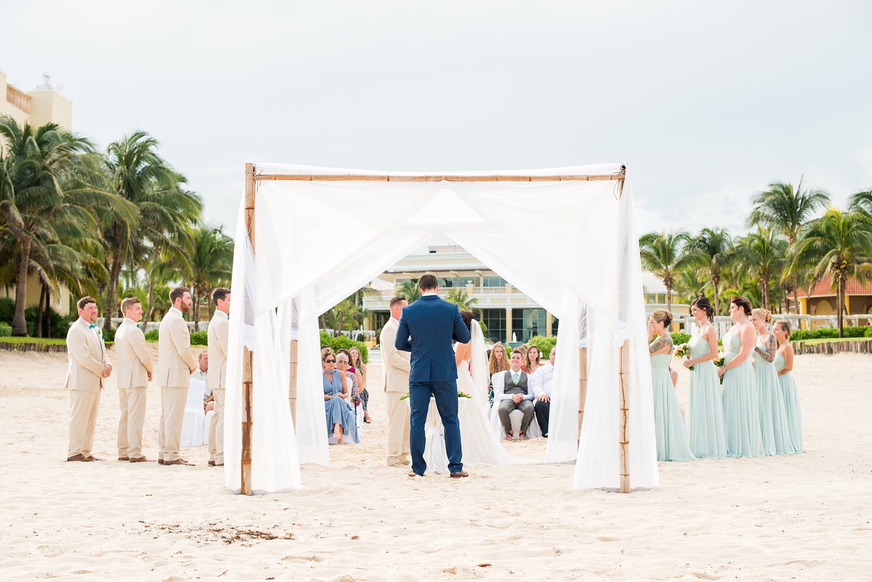 Mikkel Paige Photography photos from a wedding at Grand Paraiso, Mexico, Playa del Carmen Iberostar resort. Picture of their beach ceremony.