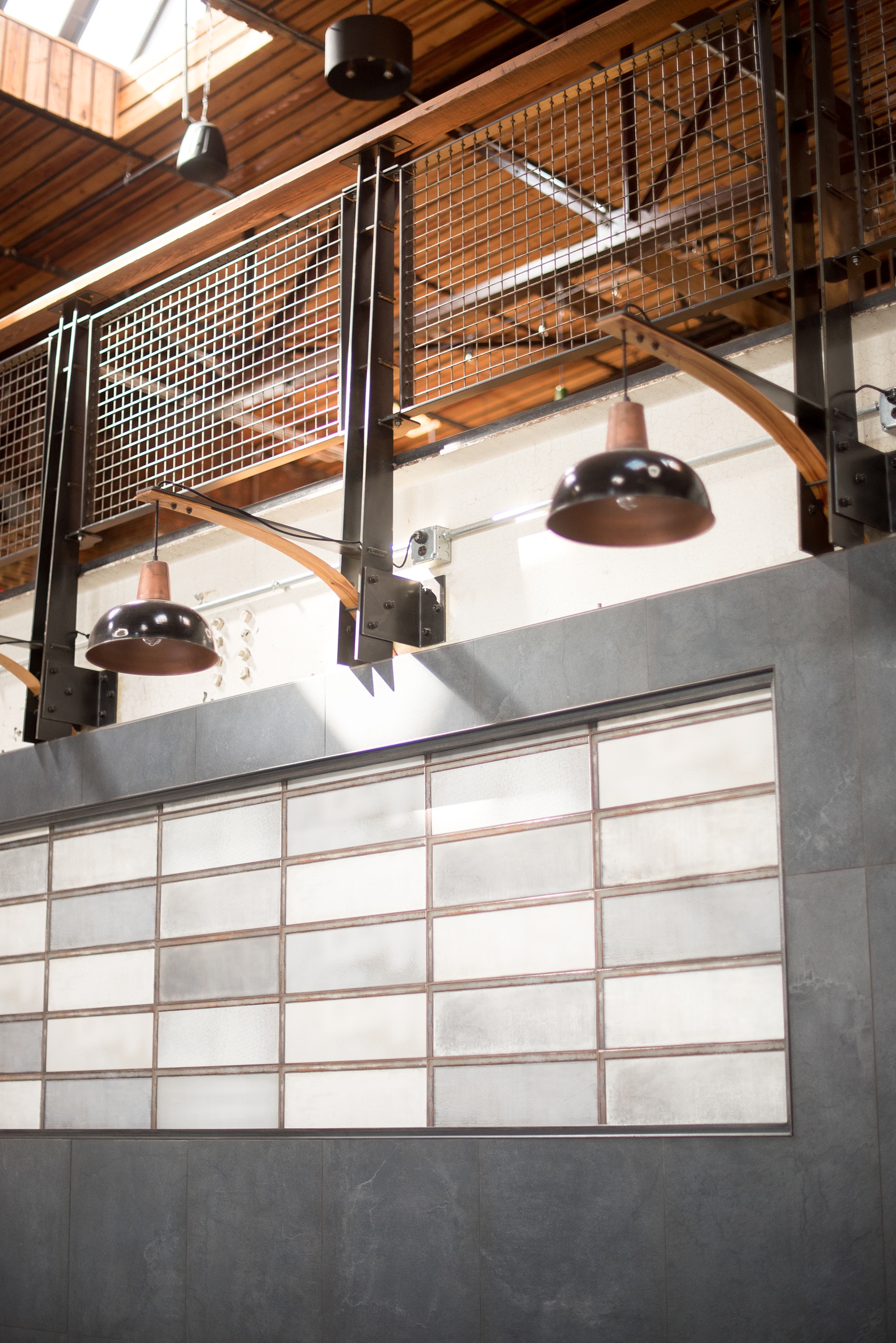 Mikkel Paige Photography pictures of Cadillac Service Garage venue in Greensboro, North Carolina. Photo of the interior reception room with tile wall. 