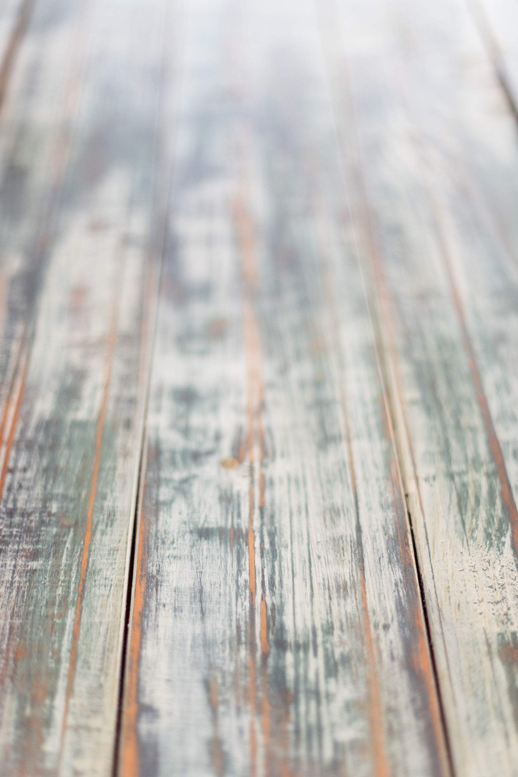 Mikkel Paige Photography pictures of Cadillac Service Garage venue in Greensboro, North Carolina. Photo of the handcrafted finish on the interior farm tables.