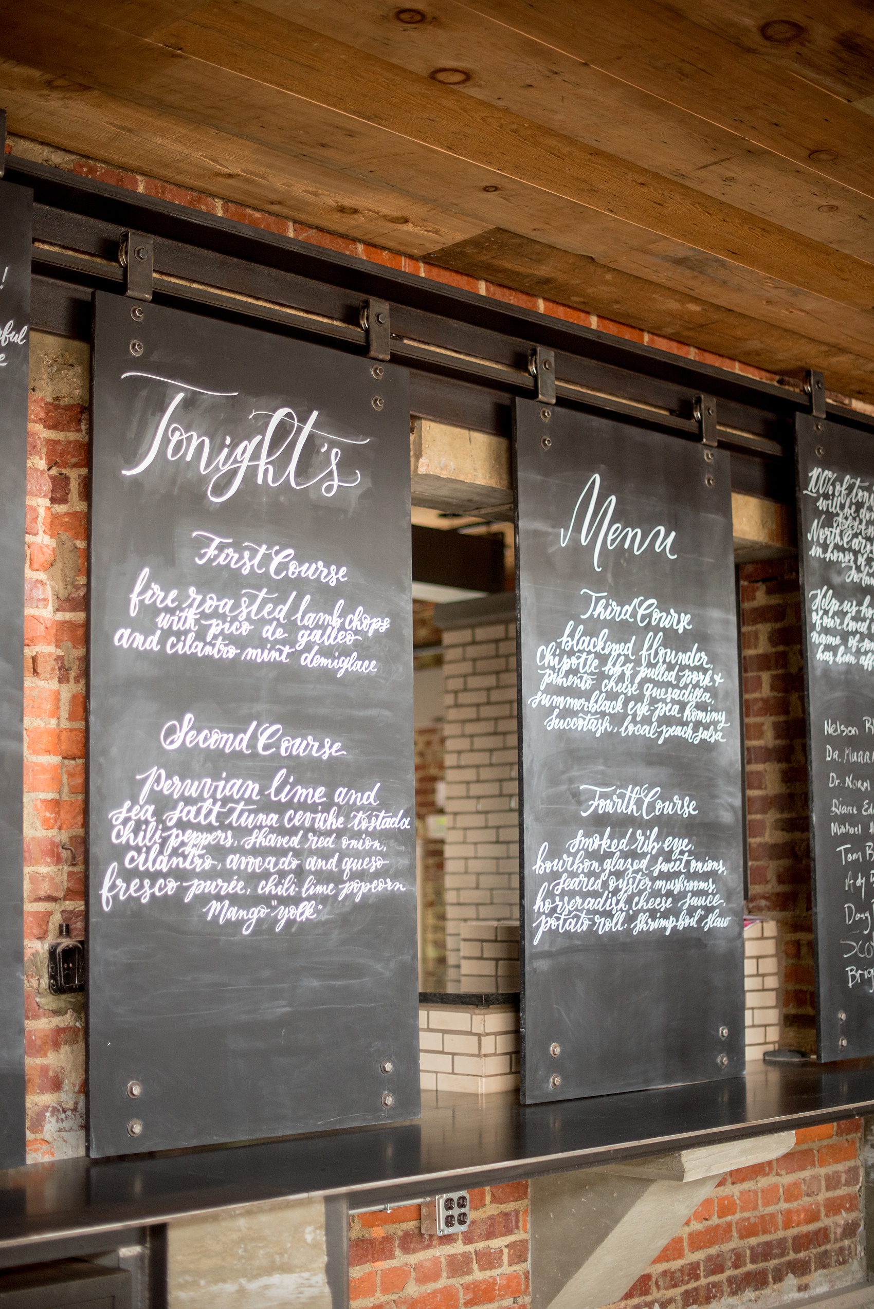Mikkel Paige Photography pictures of Cadillac Service Garage venue in Greensboro, North Carolina. Photo of the interior rolling menu boards.