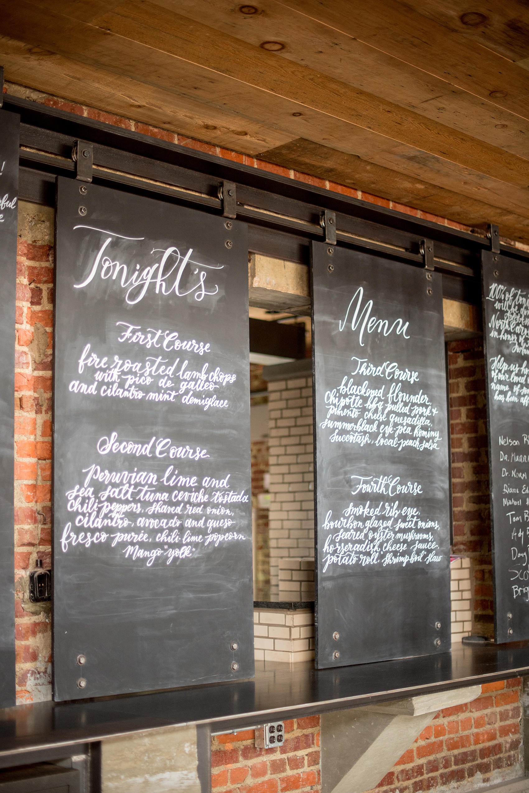 Mikkel Paige Photography pictures of Cadillac Service Garage venue in Greensboro, North Carolina. Photo of the interior rolling menu boards.