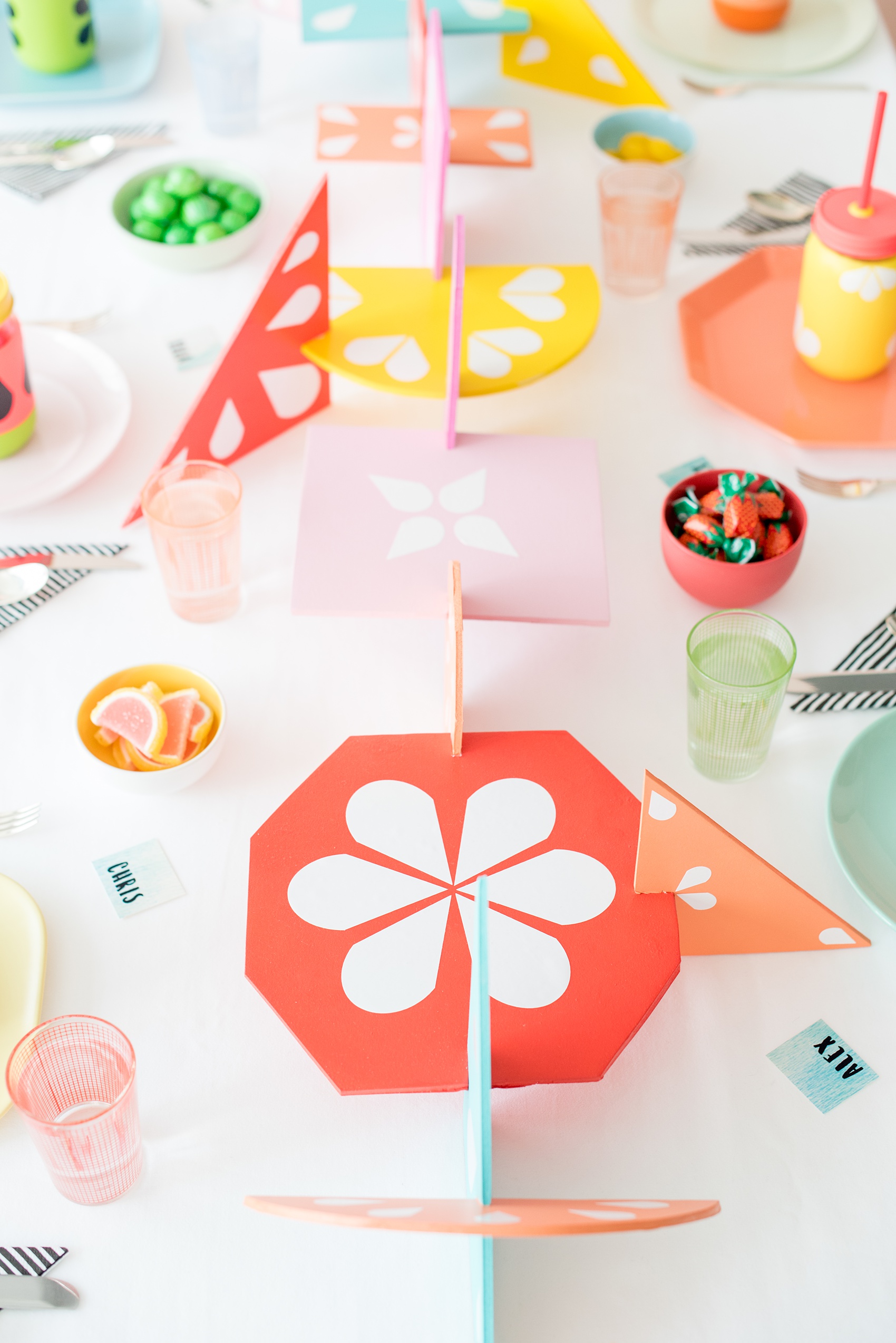 Mikkel Paige Photography photos of a Tutti Frutti theme birthday party. Featured on Martha Stewart. Picture of the kids party table by Michelle Bablo with colorful interlocking shapes. Coordination by Color Pop Events.