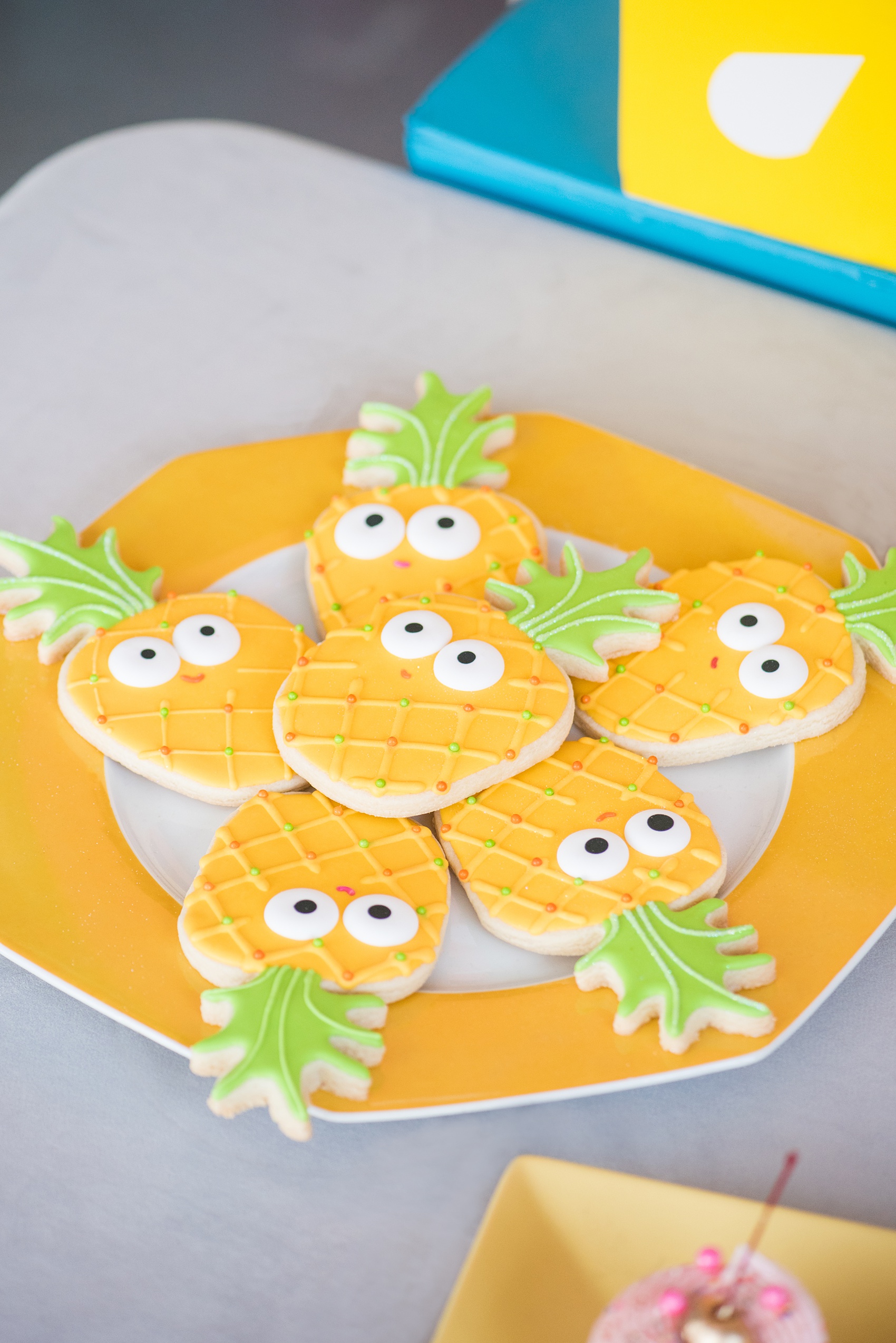 Mikkel Paige Photography photos of a Tutti Frutti theme birthday party. Featured on Martha Stewart. Picture of pineapple sugar cookies by Sweet Dani B. Planning by Color Pop Events.