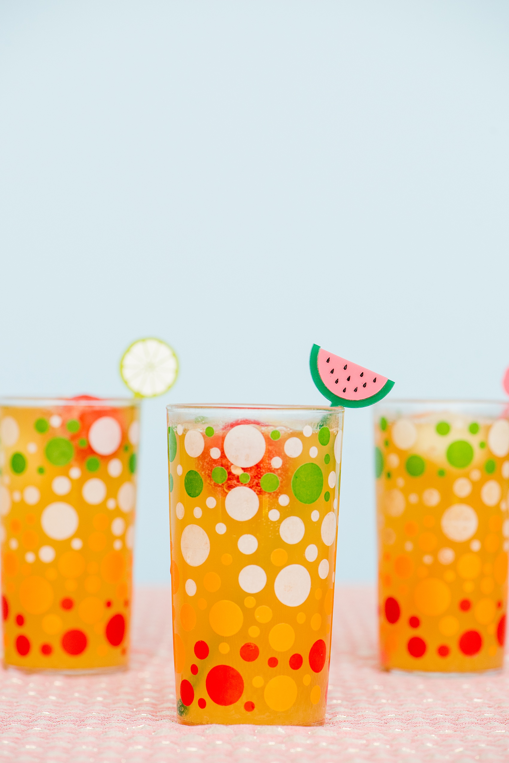 Mikkel Paige Photography photos of a Tutti Frutti theme birthday party. Featured on Martha Stewart. Picture of fruit cocktails and acrylic drink stirrers by California Lustre. Coordination by Color Pop Events.