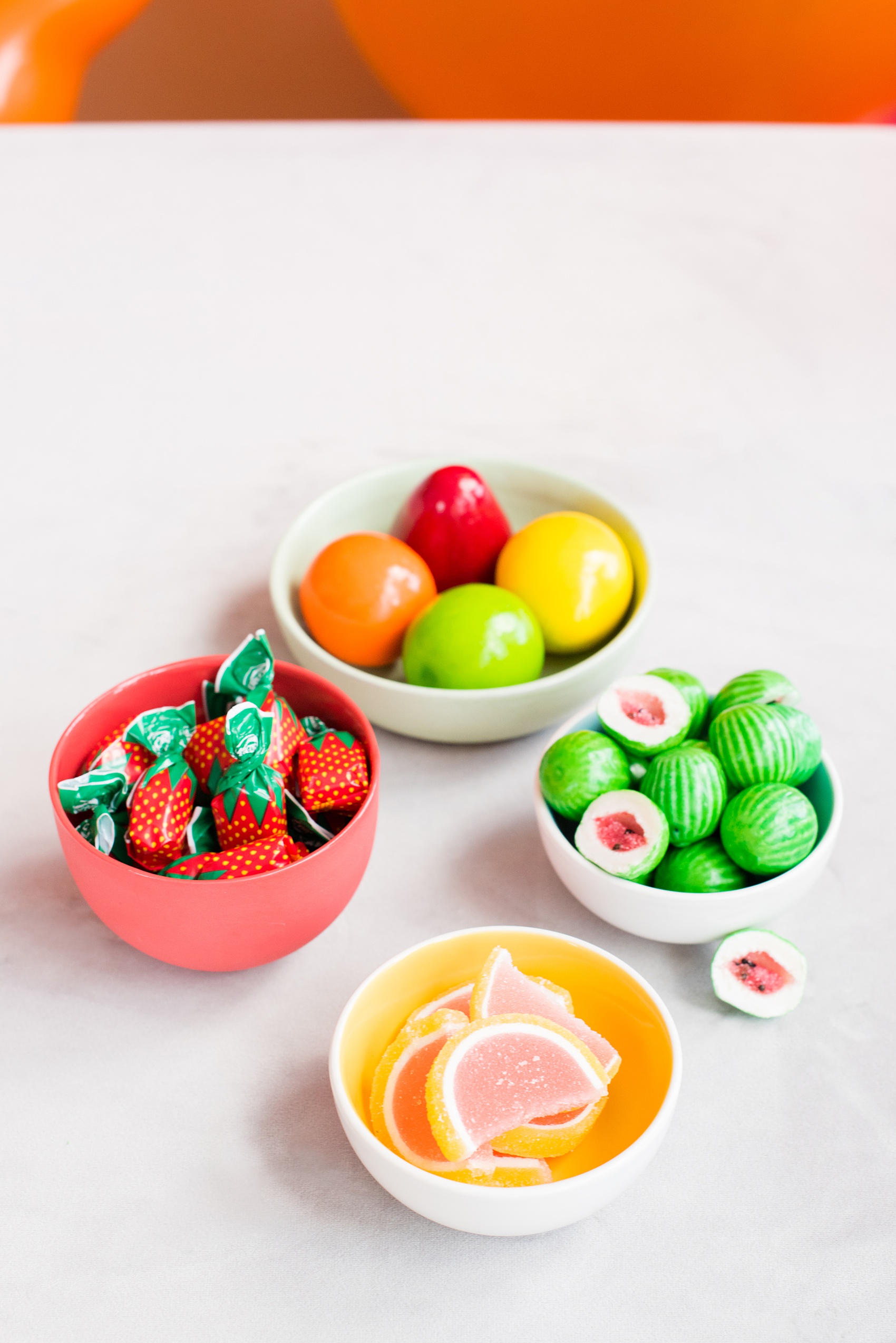 Mikkel Paige Photography photos of a Tutti Frutti theme birthday party. Featured on Martha Stewart. Picture of fruit candy bowls, styled by Sweet Dani B. Coordination by Color Pop Events.