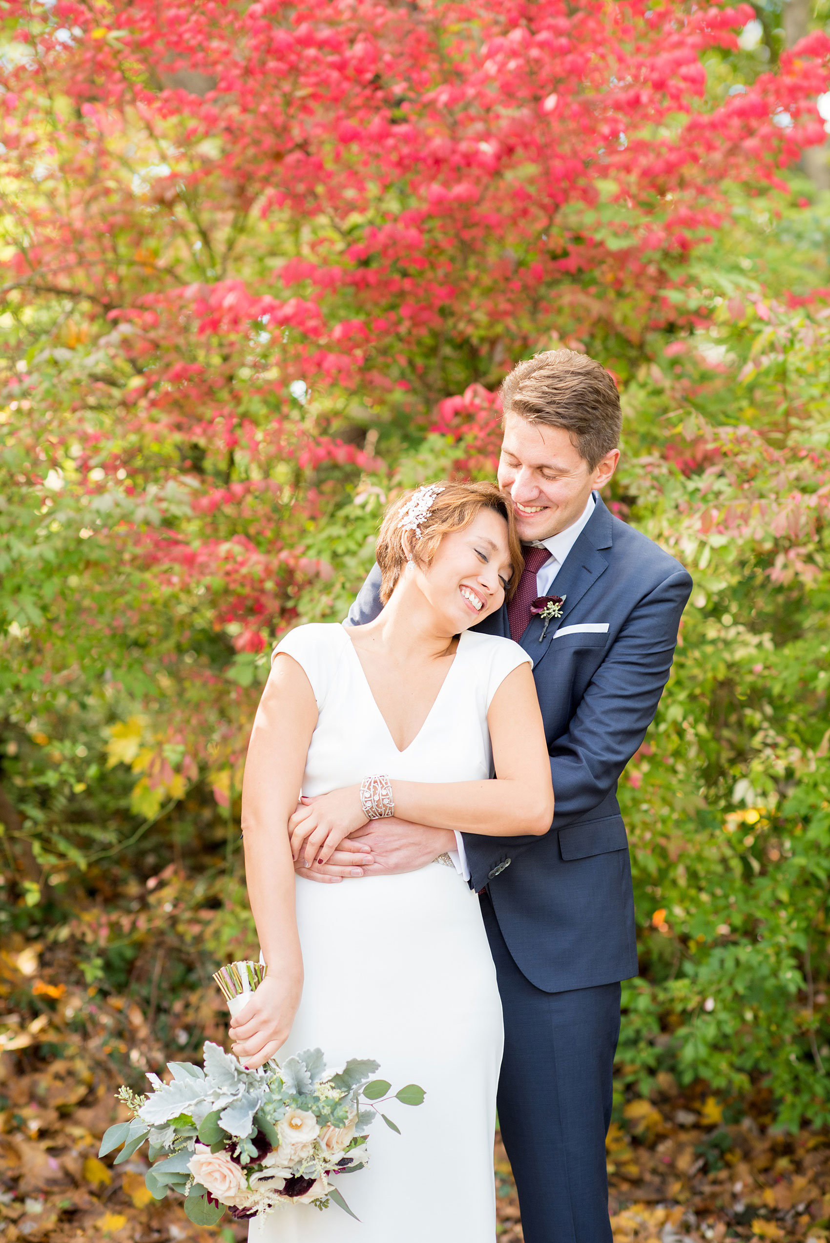 Mikkel Paige Photography photos from a wedding at Crabtree's Kittle House. Fall picture of the bride and groom with colorful leaves.