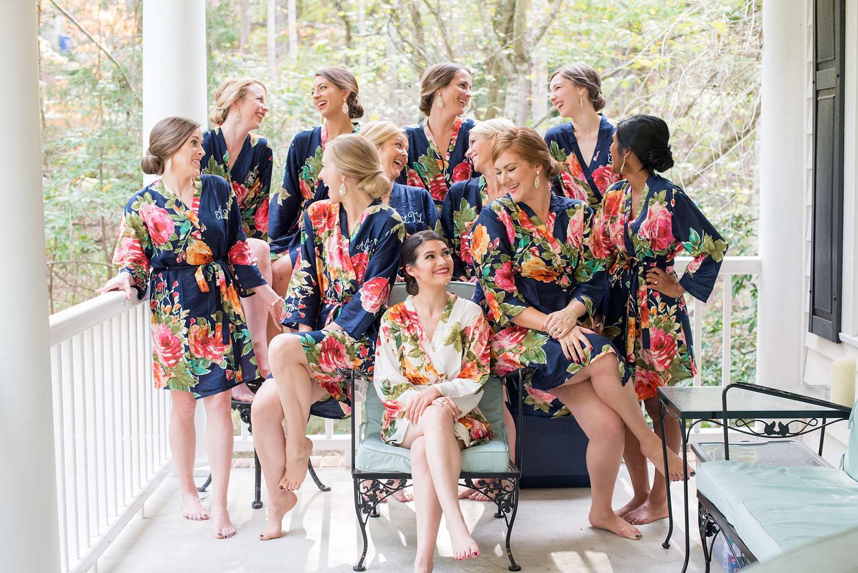 Mikkel Paige Photography photo of a wedding in Chapel Hill at Duke Chapel. Picture of the bridesmaids and bride getting ready in personalized floral robes.