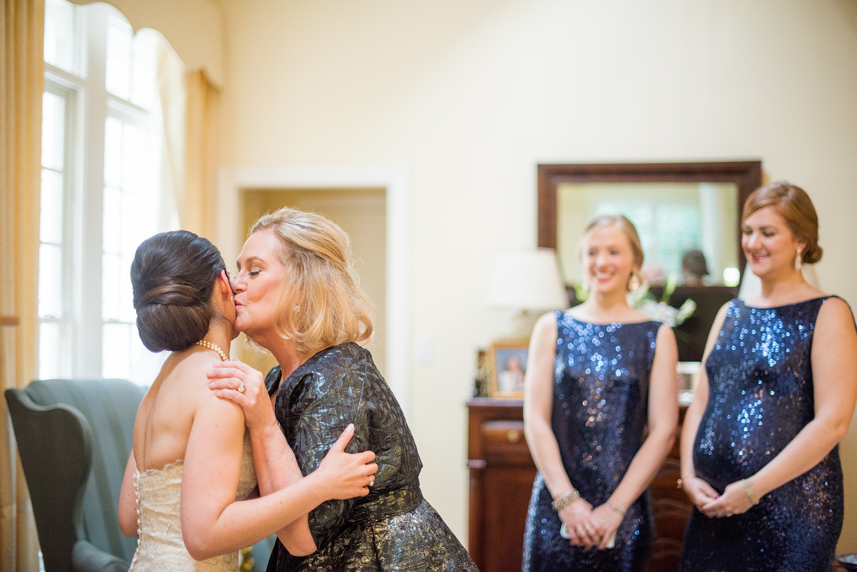 Mikkel Paige Photography photo of a wedding in Chapel Hill at Duke Chapel. A picture of the bride getting ready with her mother.