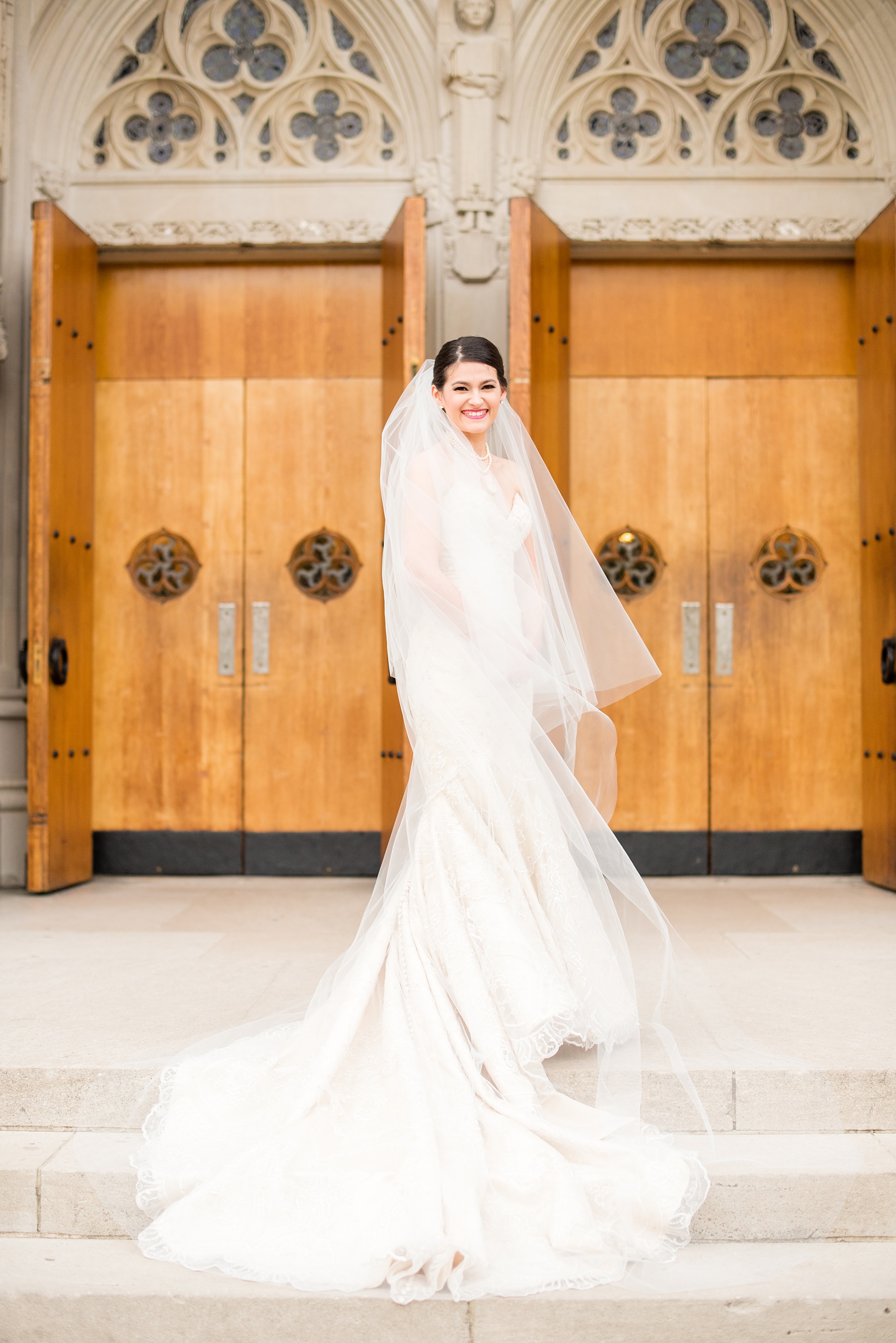 Mikkel Paige Photography photo of a wedding in Chapel Hill at Duke Chapel. Bride and groom with the gothic architecture. A portrait picture of the bride in front of the gothic church.