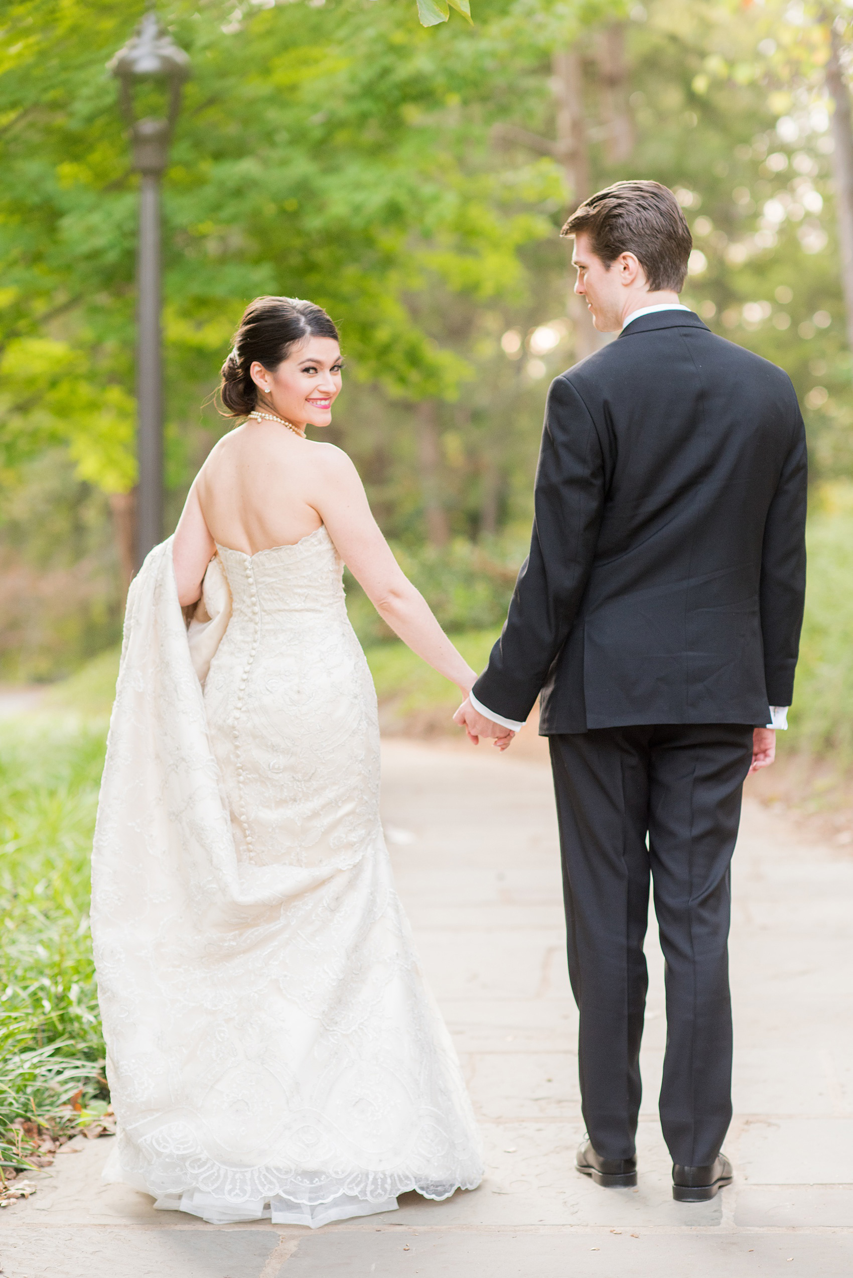 Mikkel Paige Photography photo of a wedding in Chapel Hill at Duke Chapel. A picture of the bride and groom walking on the church property.