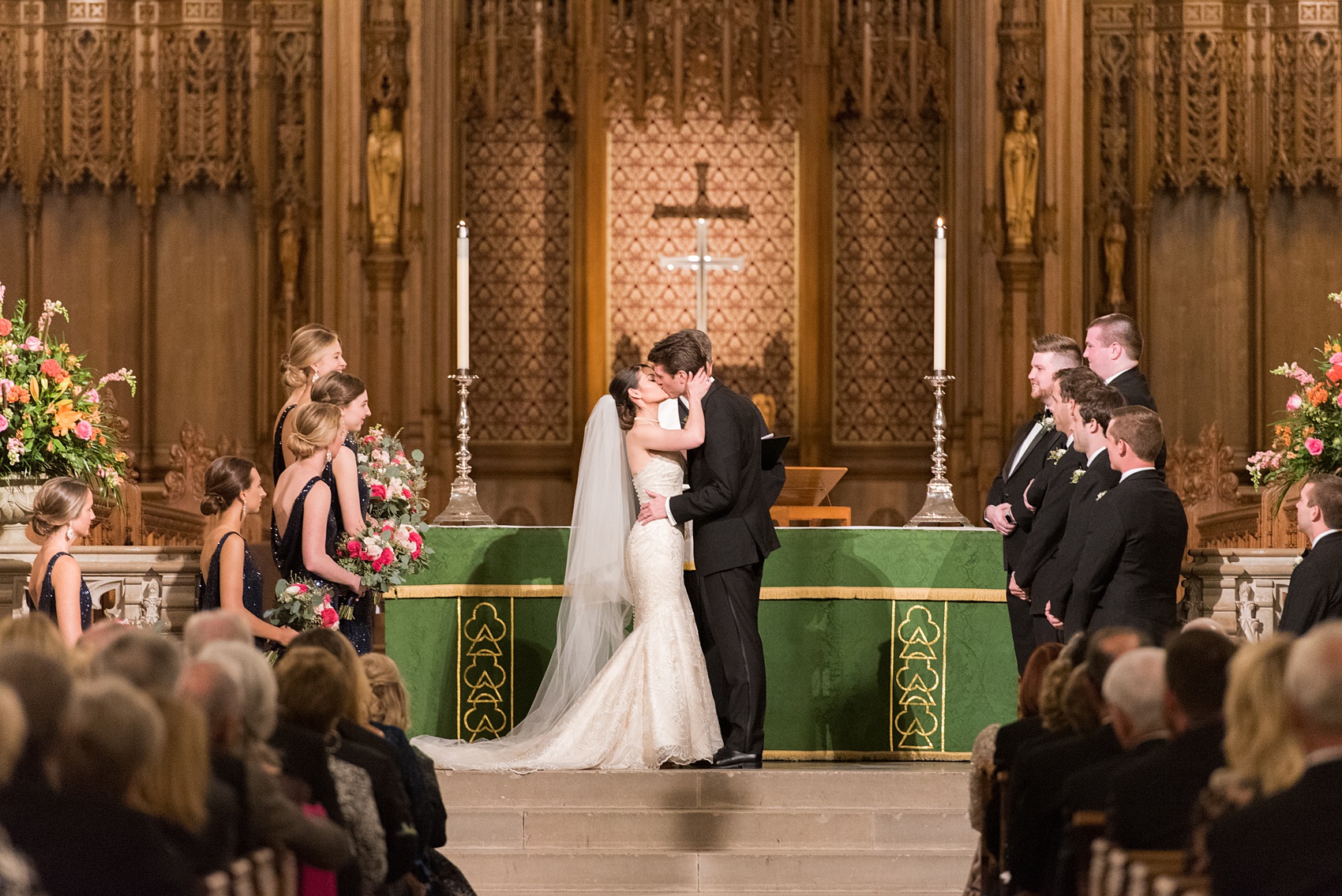 Mikkel Paige Photography photo of a wedding in Chapel Hill at Duke Chapel. Bride and groom with the gothic architecture. Picture of the first kiss with the bride and groom during the ceremony inside the gothic church.