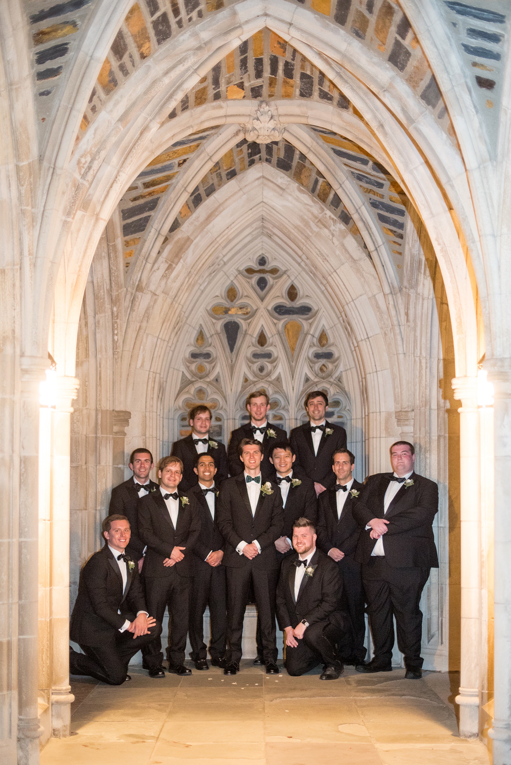 Mikkel Paige Photography photo of a wedding in Chapel Hill at Duke Chapel. Picture of the groomsmen in classic black tuxedos and bow ties at the gothic church.
